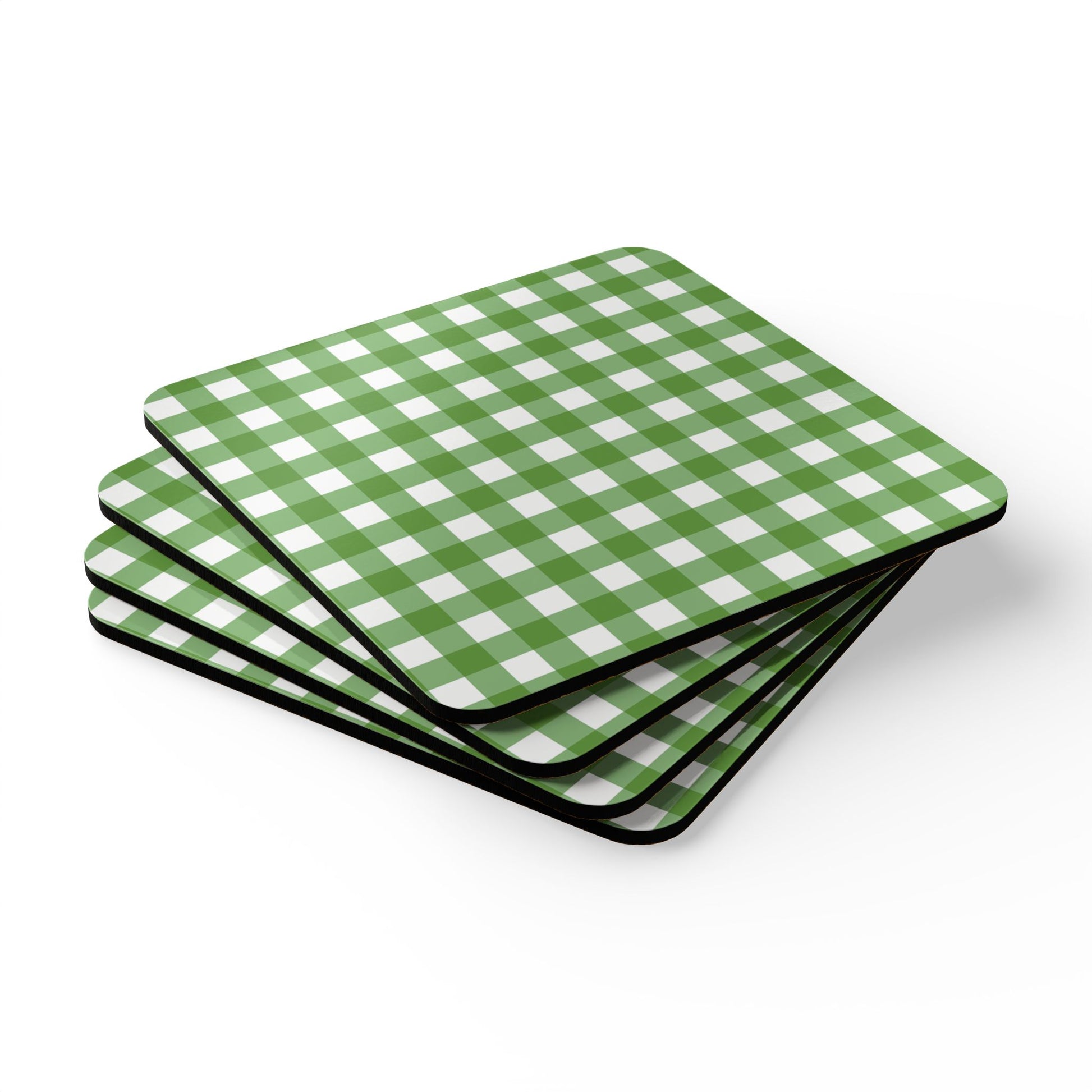 Four green and white gingham checkered coasters stacked on a white background