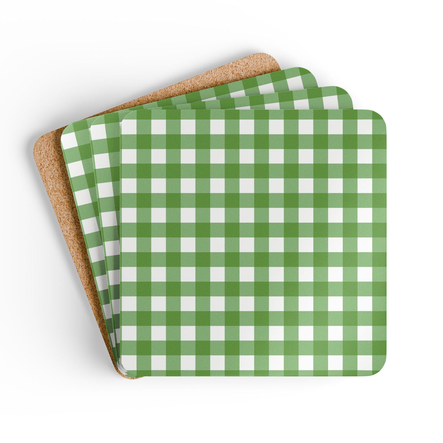 Set of green and white gingham checkered coasters with cork backing on a white background