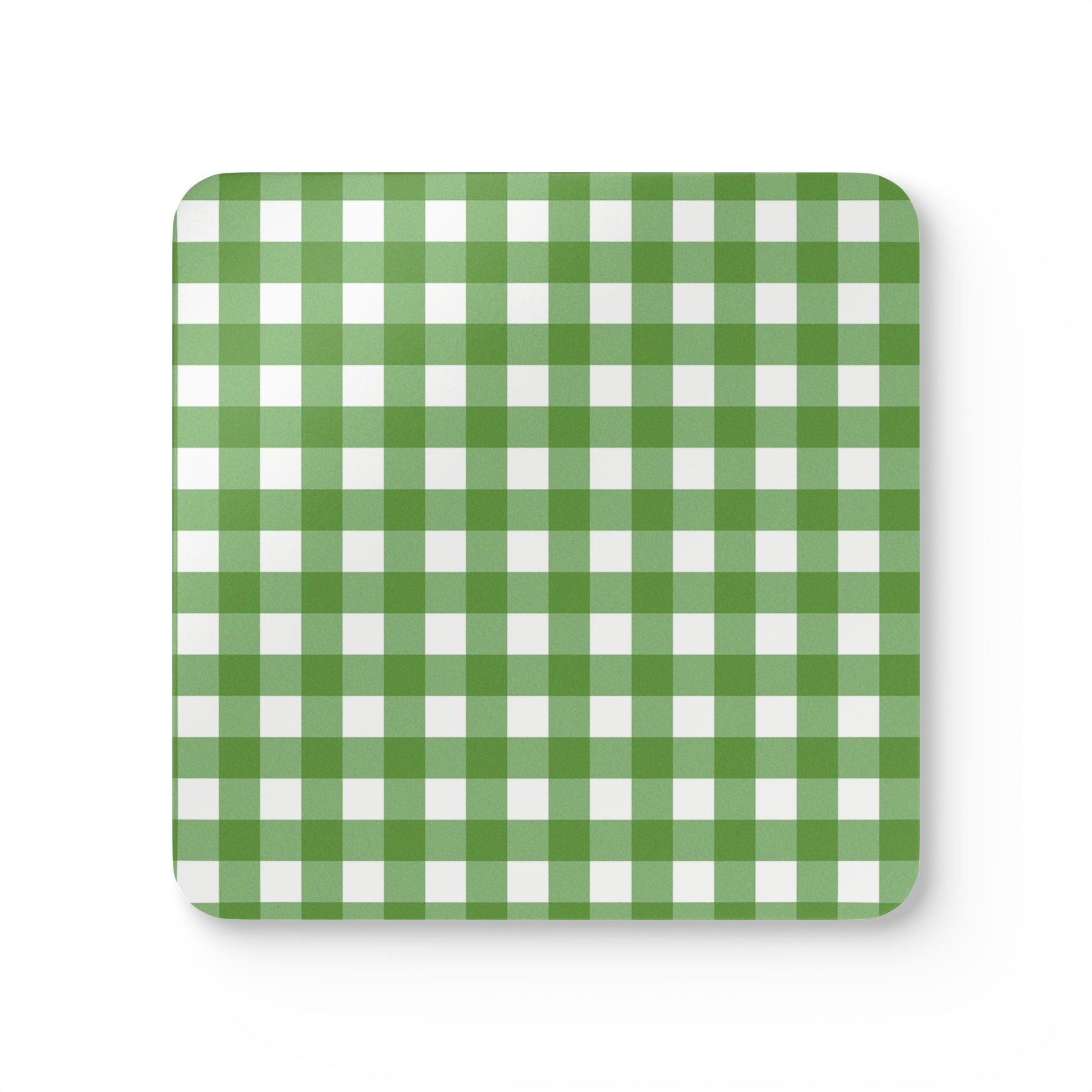 Green and white gingham checkered coaster with green and white pattern on front of coaster a white background.