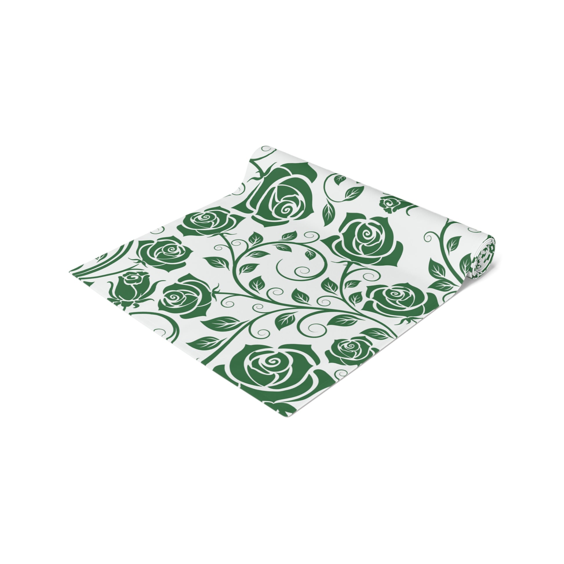 Table runner with green rose pattern rolled up on a white background