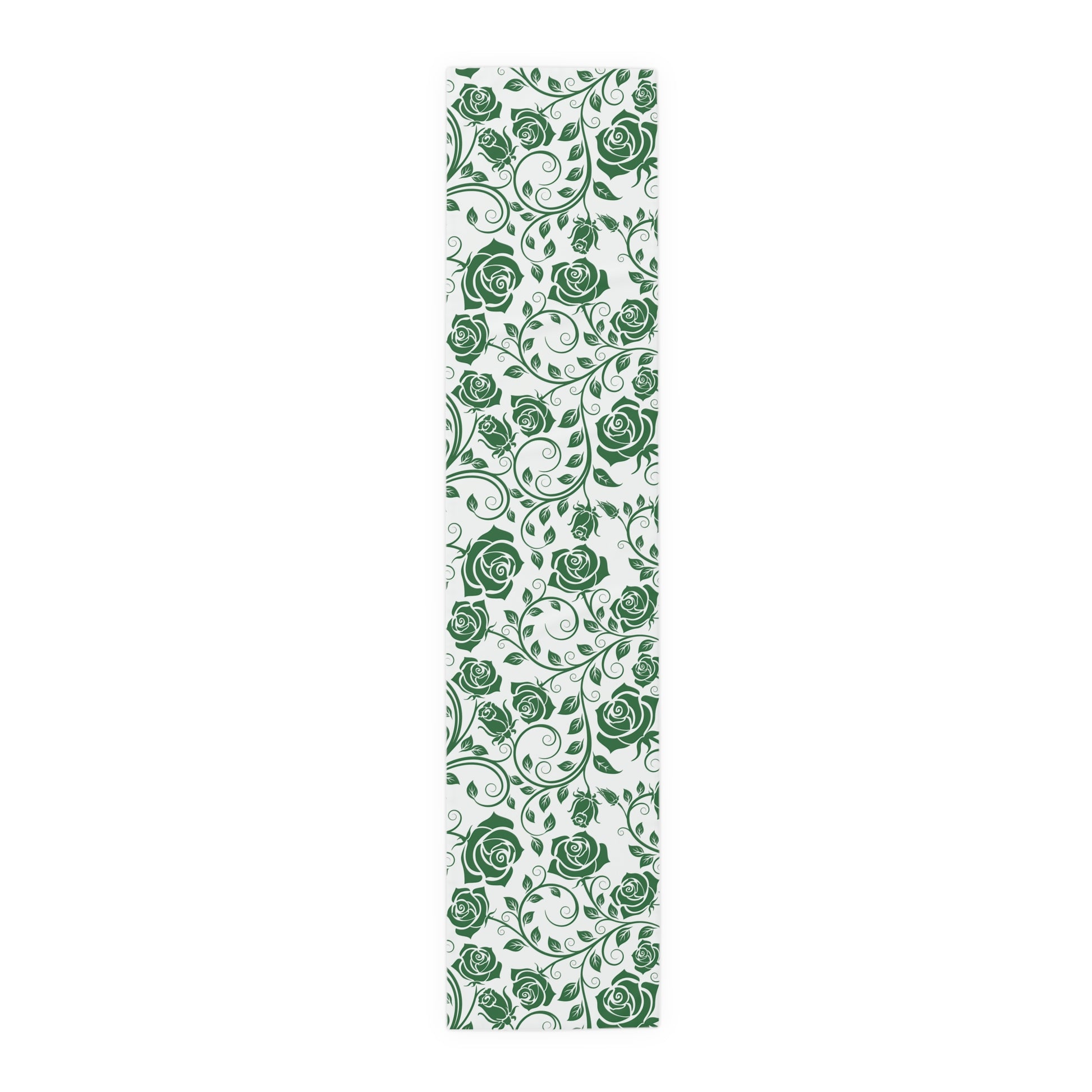 Table runner with green floral pattern on a white background