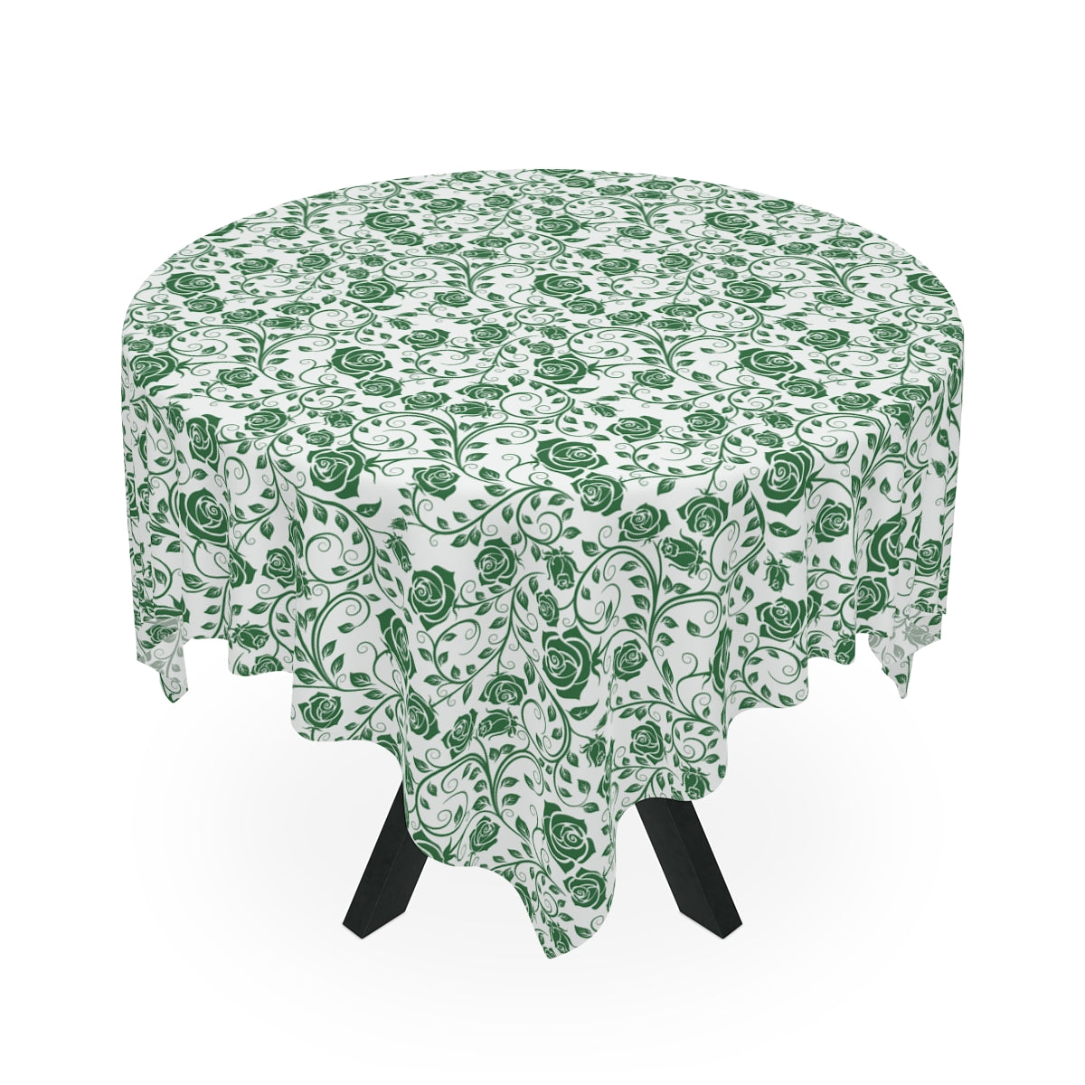 Round table with a green floral patterned tablecloth on a white background