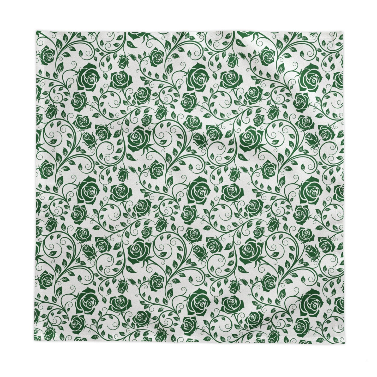 Green and white floral pattern square tablecloth on a white background
