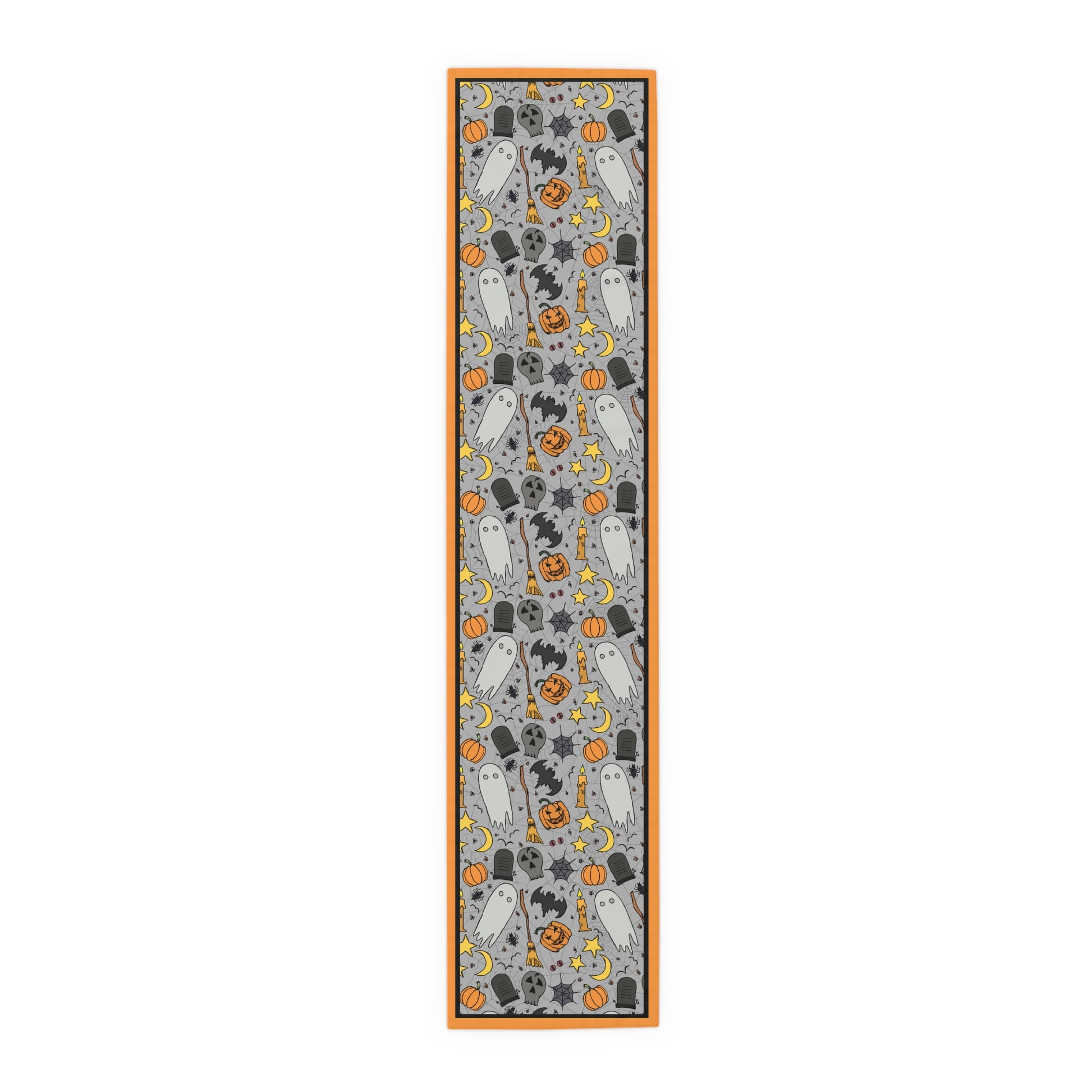 Halloween-themed table runner with ghosts, pumpkins, and bats with a gray background,