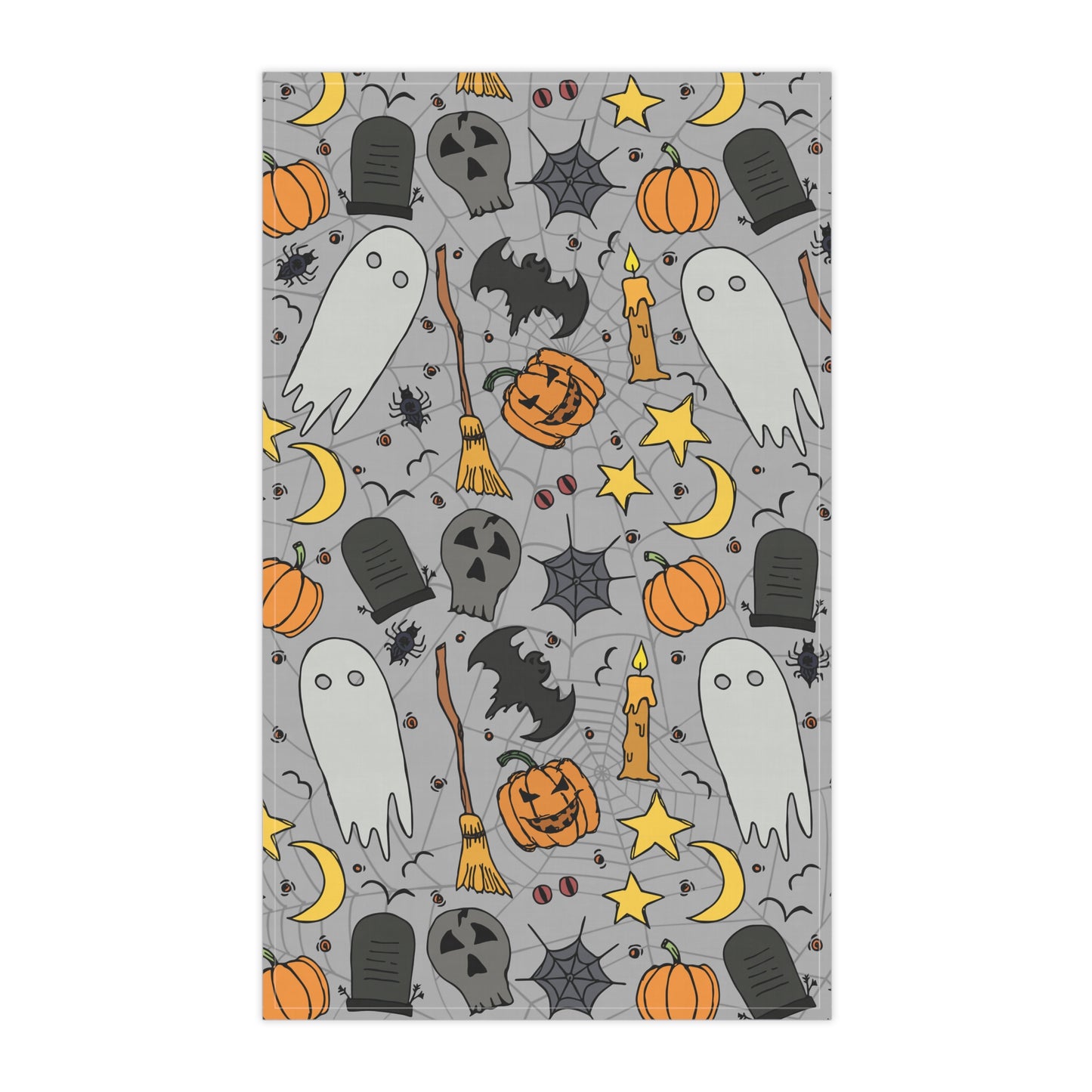 Halloween-themed tea towel with ghosts, pumpkins, and bats on a gray background printed on front of kitchen towel, with a gray background on a white background.