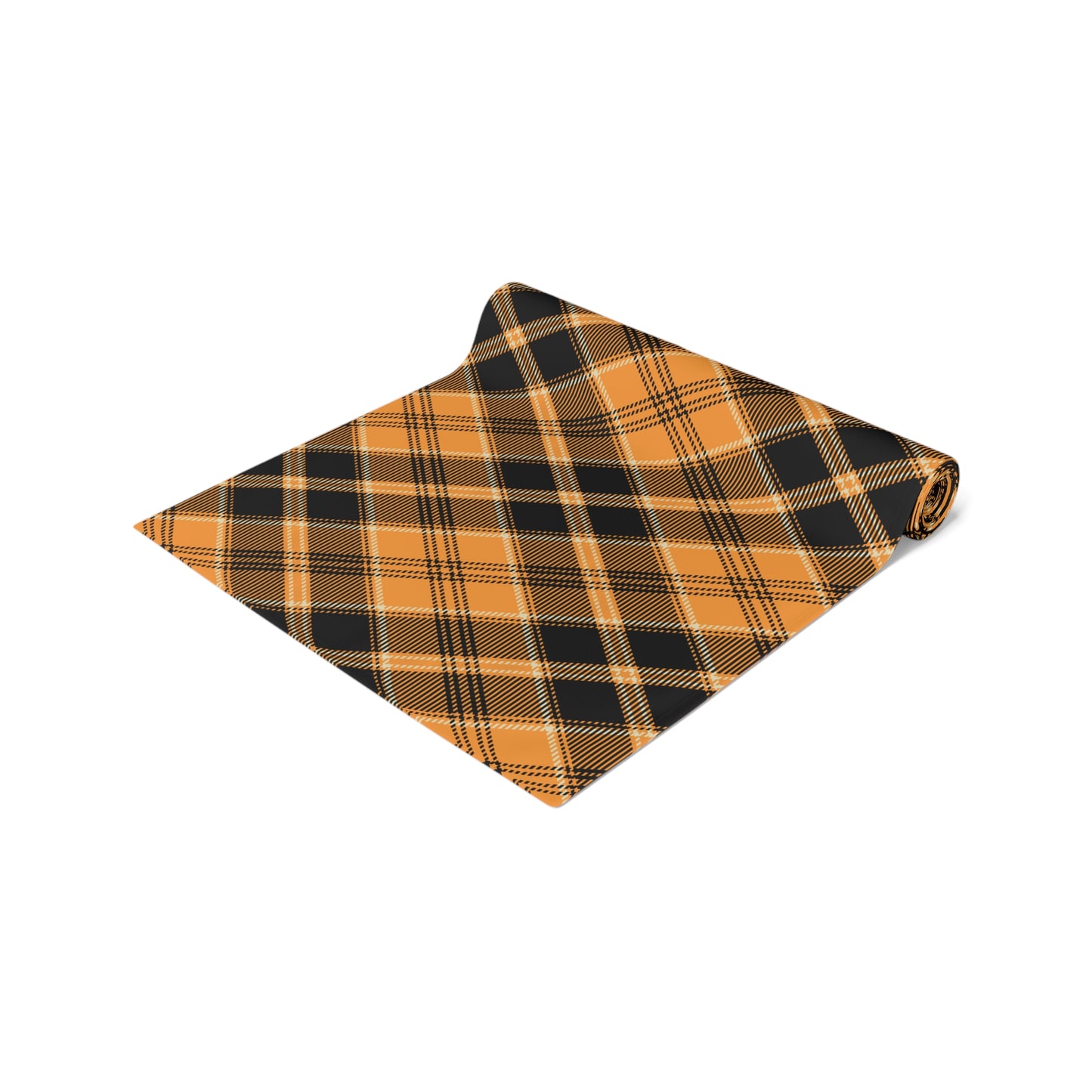 Pumpkin plaid table runner has a black and orange plaid pattern on front of table runner, rolled up on a white background.