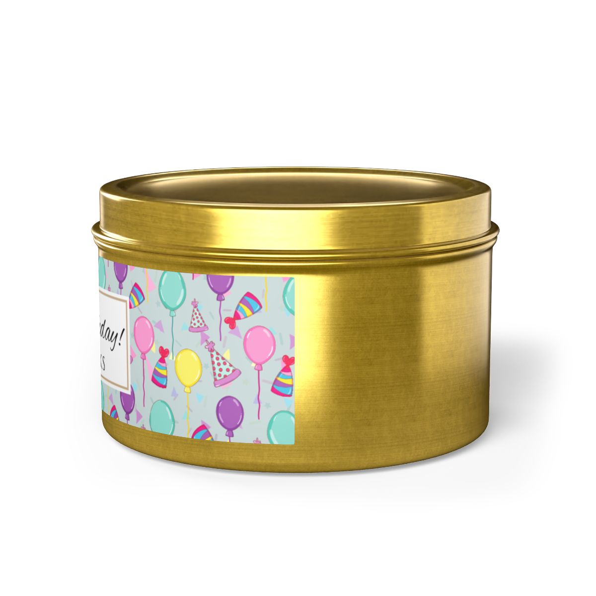 Side view of gold candle tin with 'Happy Birthday' label with colorful balloon, birthday hats and confetti design on a white background
