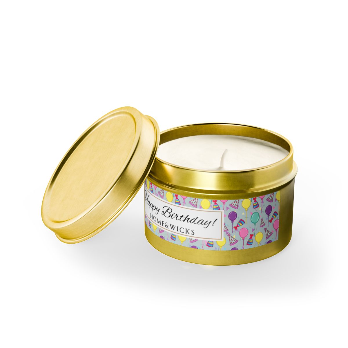 Open cotton wicked Happy Birthday gold 4 oz. candle tin with gold lid with a colorful label with birthday hats, balloons and confetti on a white background