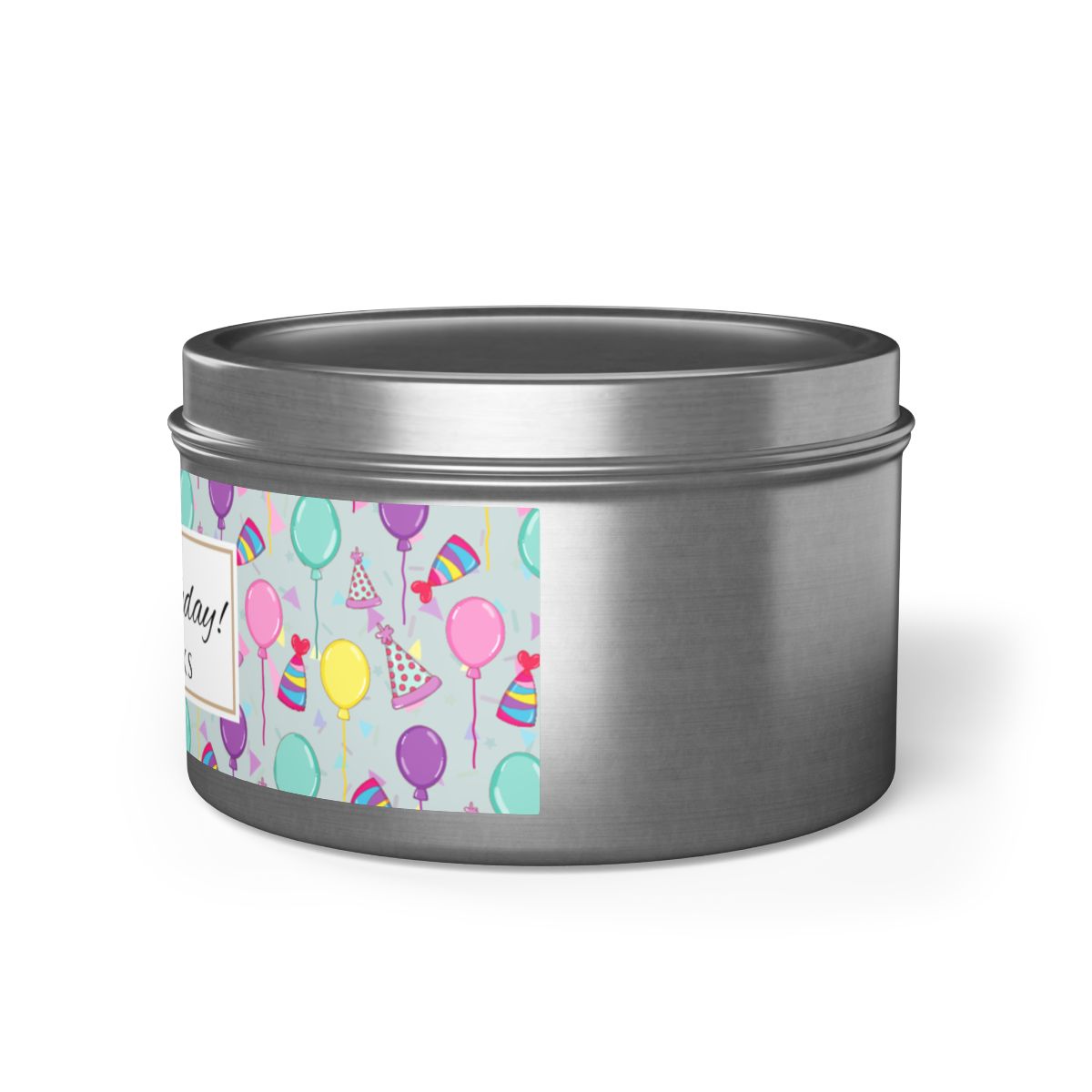 Side view of silver candle tin with 'Happy Birthday' label and colorful balloon, birthday hats and confetti design on a white background