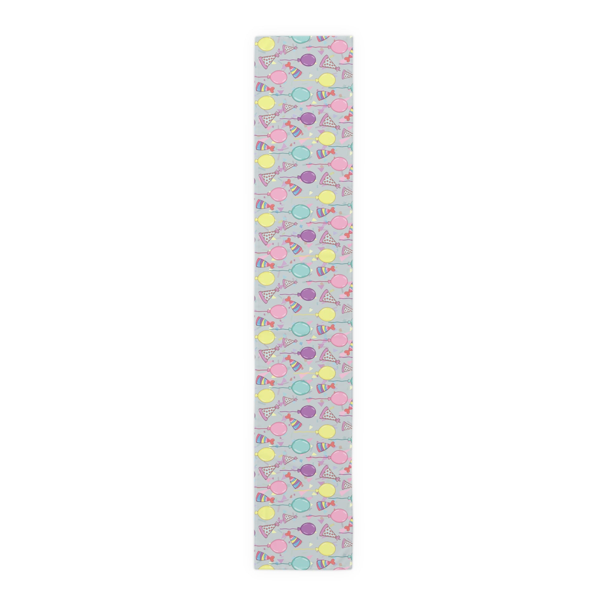 Table runner with colorful birthday party hats, confetti and balloons pattern on a gray background
