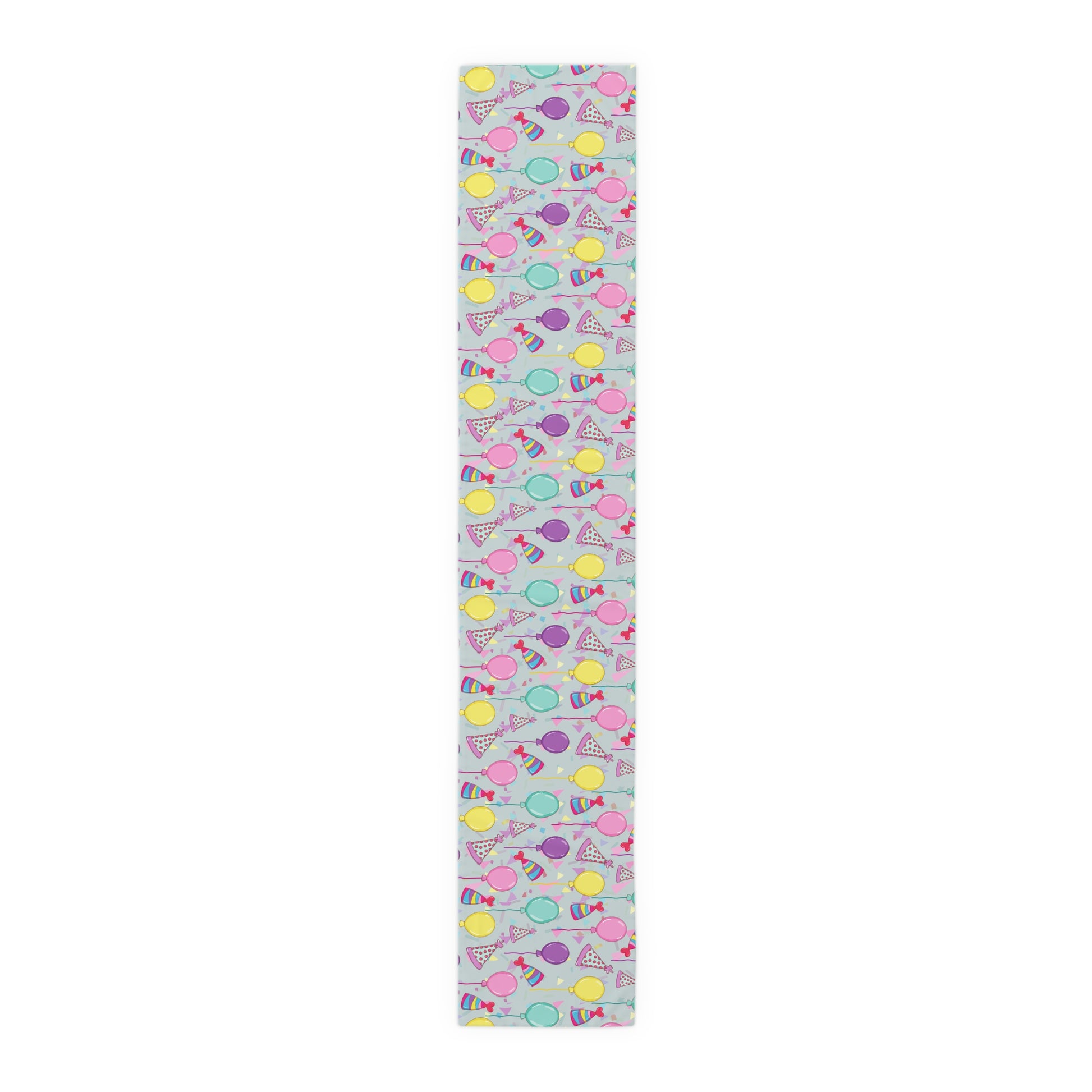 Table runner with colorful birthday party hats, confetti and balloons pattern on a white background