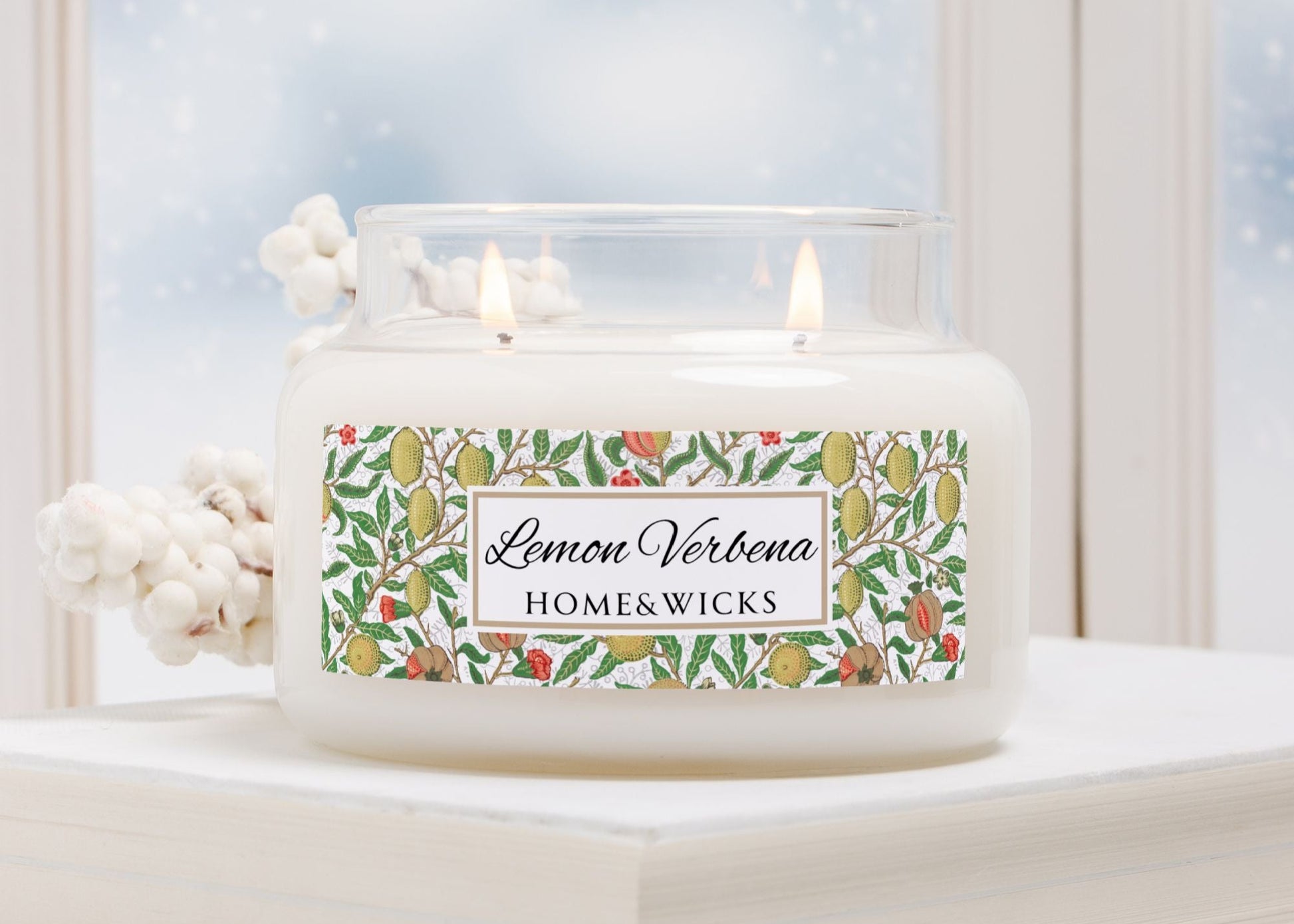 Candle with 'Lemon Verbena' label on a decorative surface