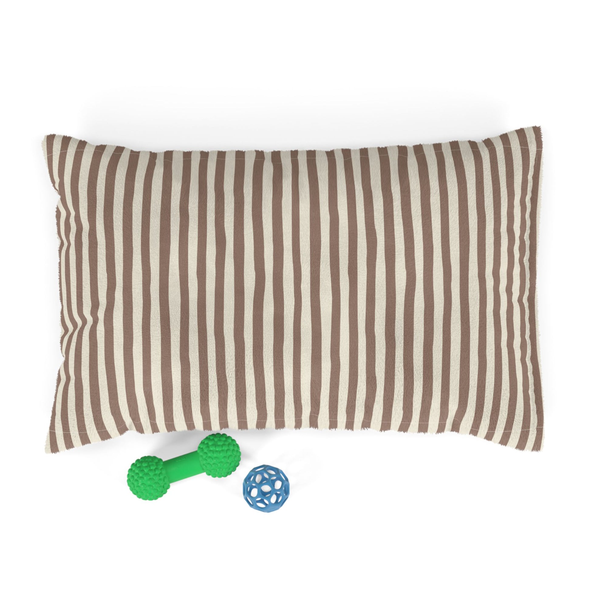 Mocha brown striped dog pet bed pillow with two dog toys on a white background