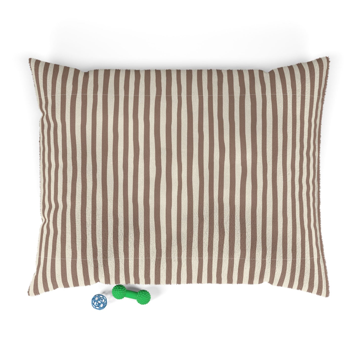 Mocha brown striped dog pet bed pillow with two dog toys on a white background