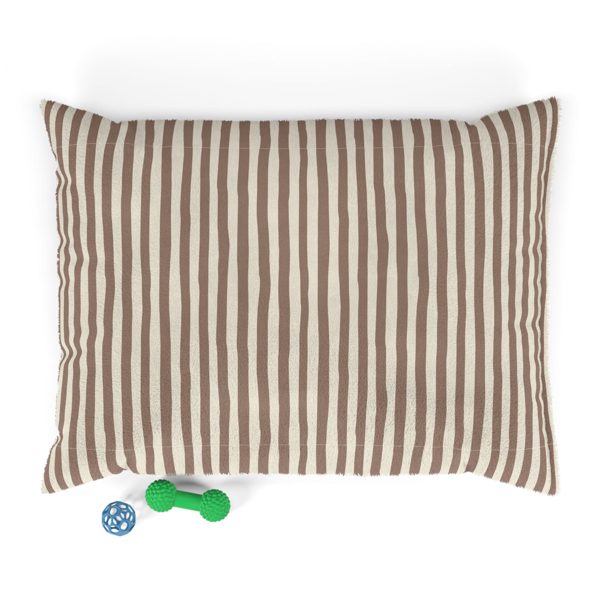 Mocha brown striped dog bed pillow with two dog toys on a white background