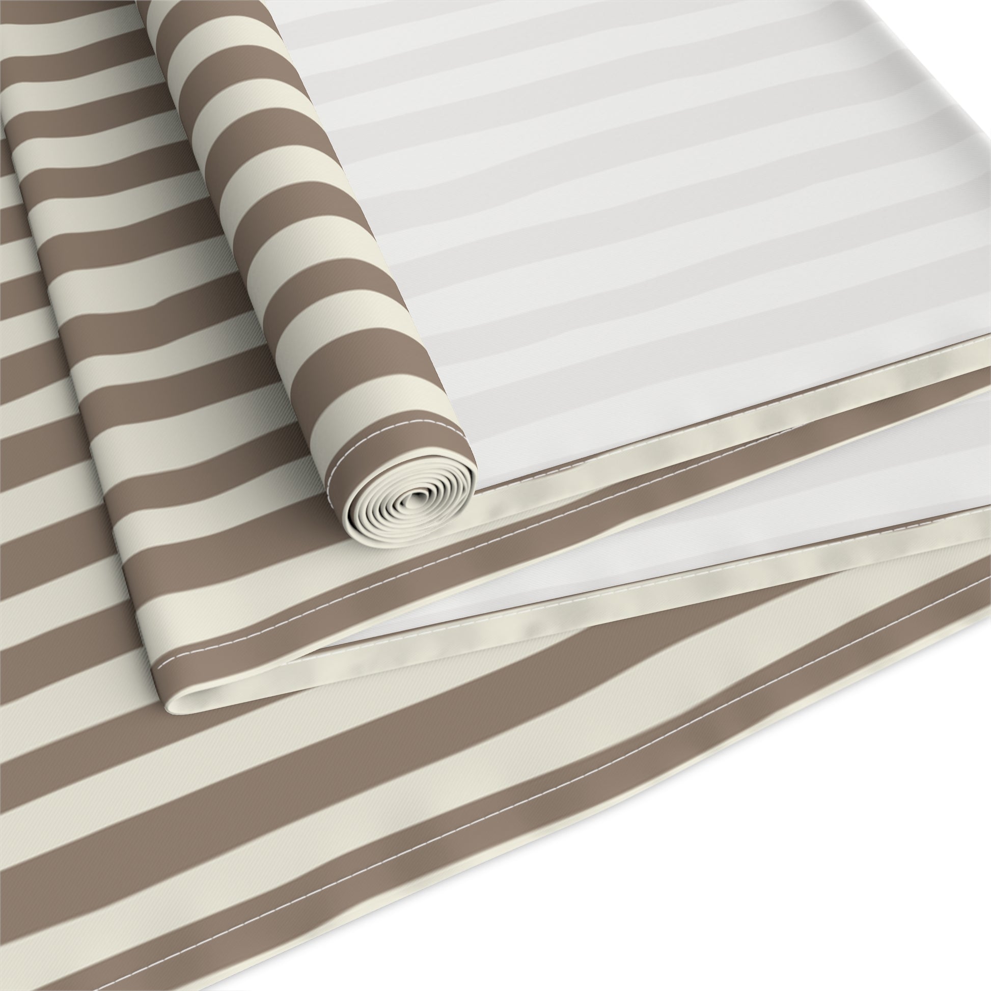 Roll of brown and beige striped table runner on a white background