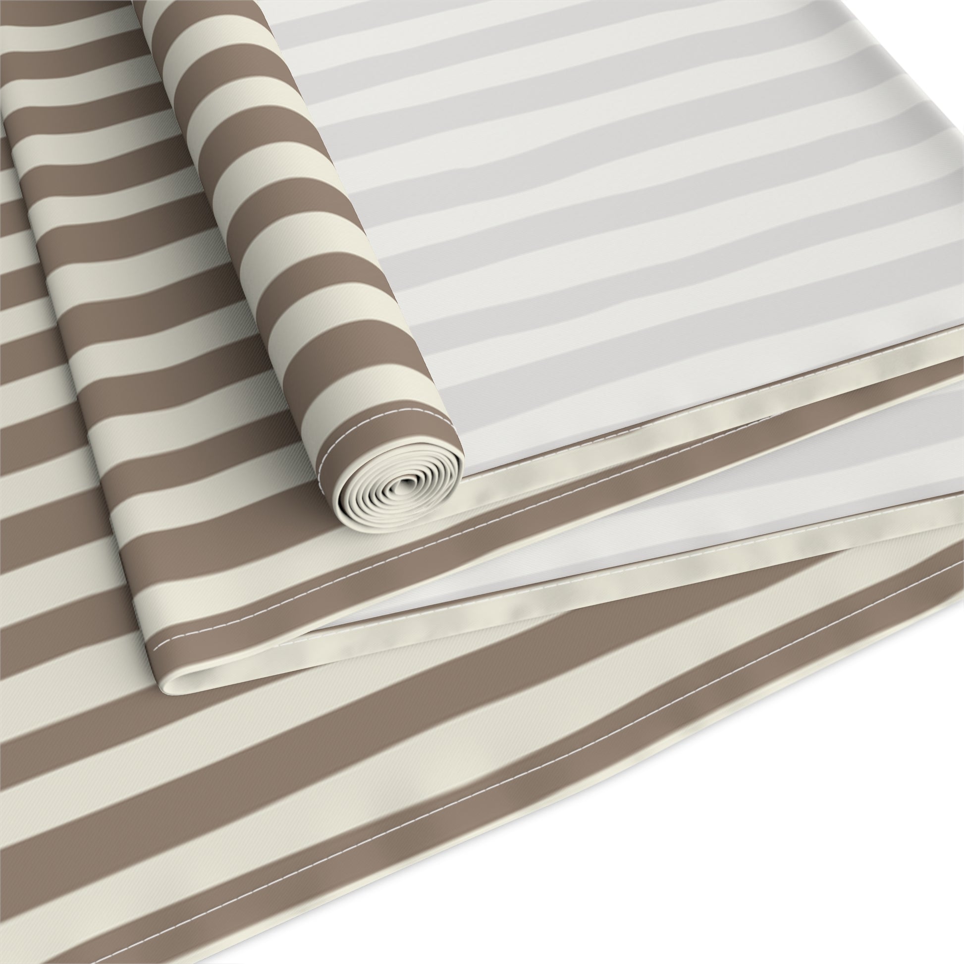 Roll of brown and beige striped table runner on a white background