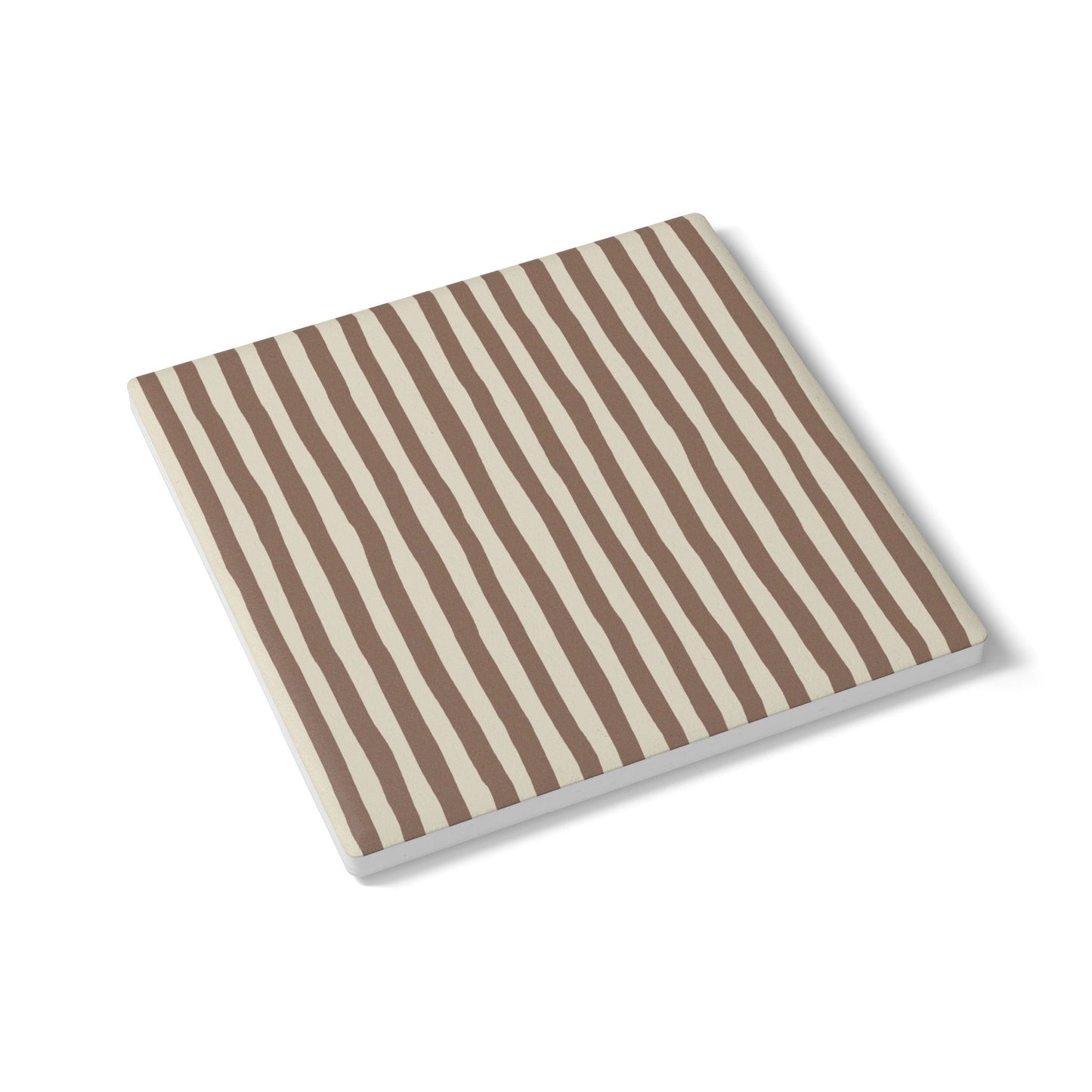 Square ceramic tile coaster with brown and beige vertical stripes on a white background