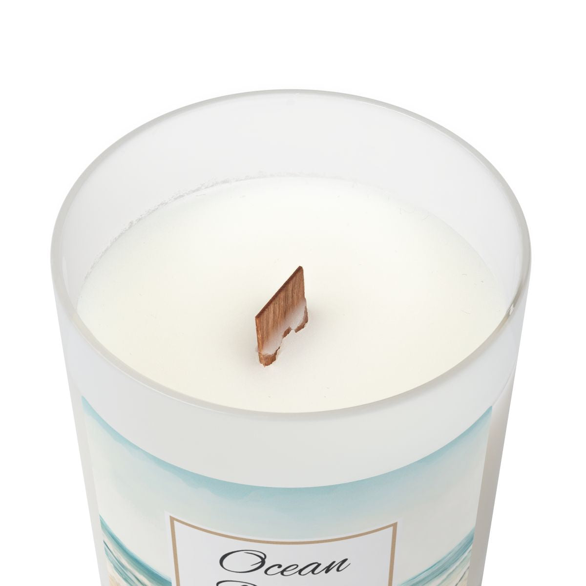 Wood wick candle in a white container with 'Ocean' label on a white background