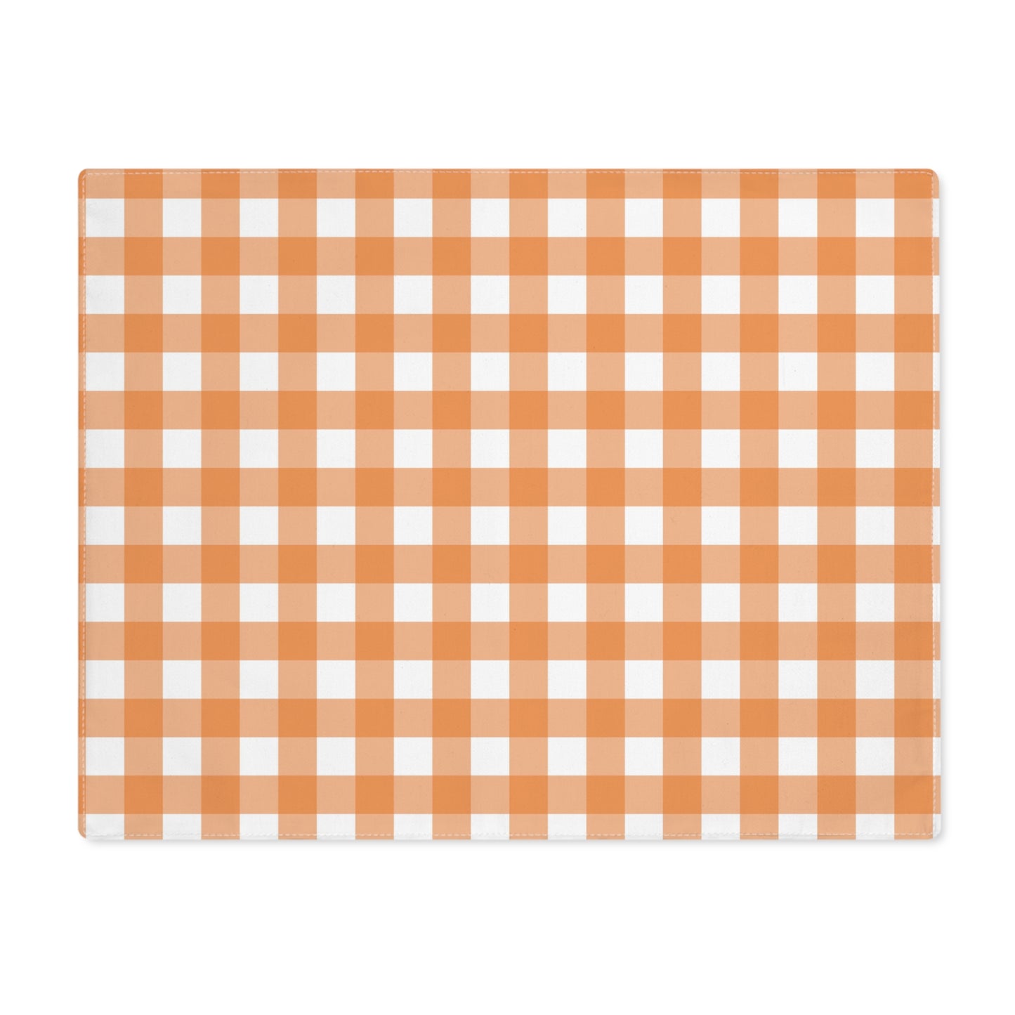 Our Orange Gingham placemat with an orange and white checkered pattern on the table runner fabric on a white backaground