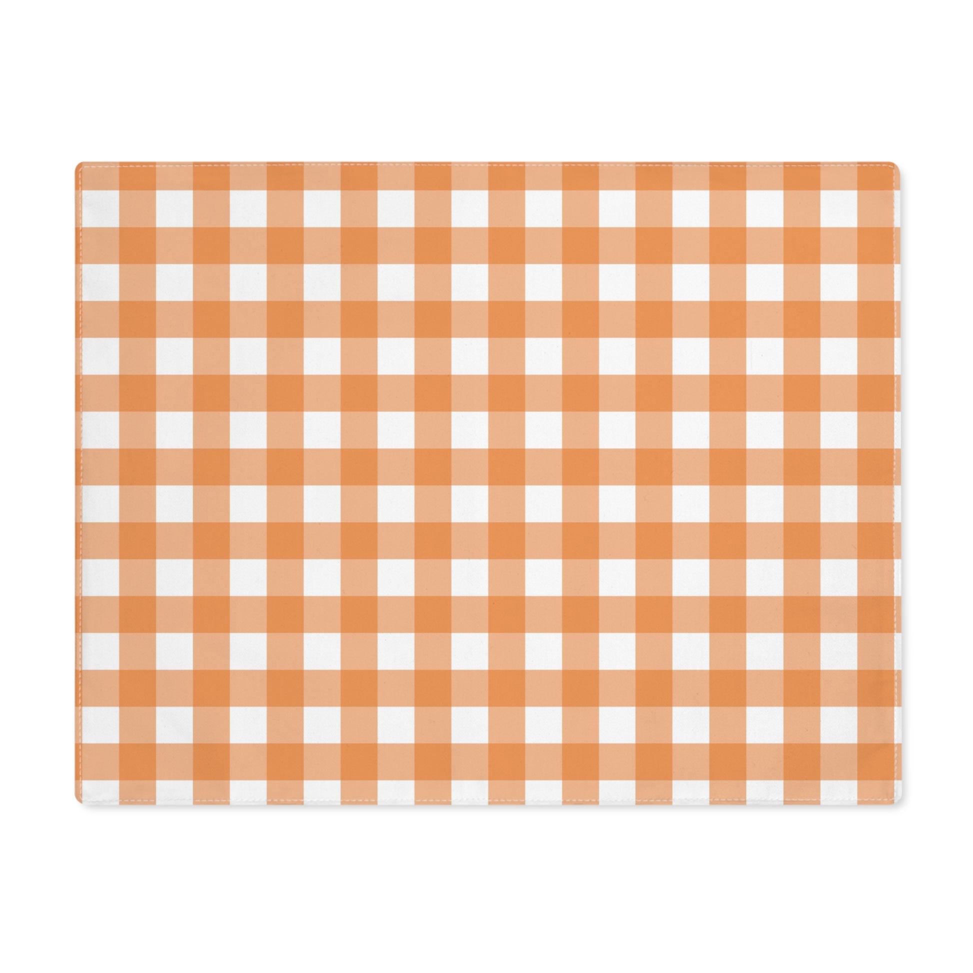 Our Orange Gingham placemat with an orange and white checkered pattern on the table runner fabric on a white backaground