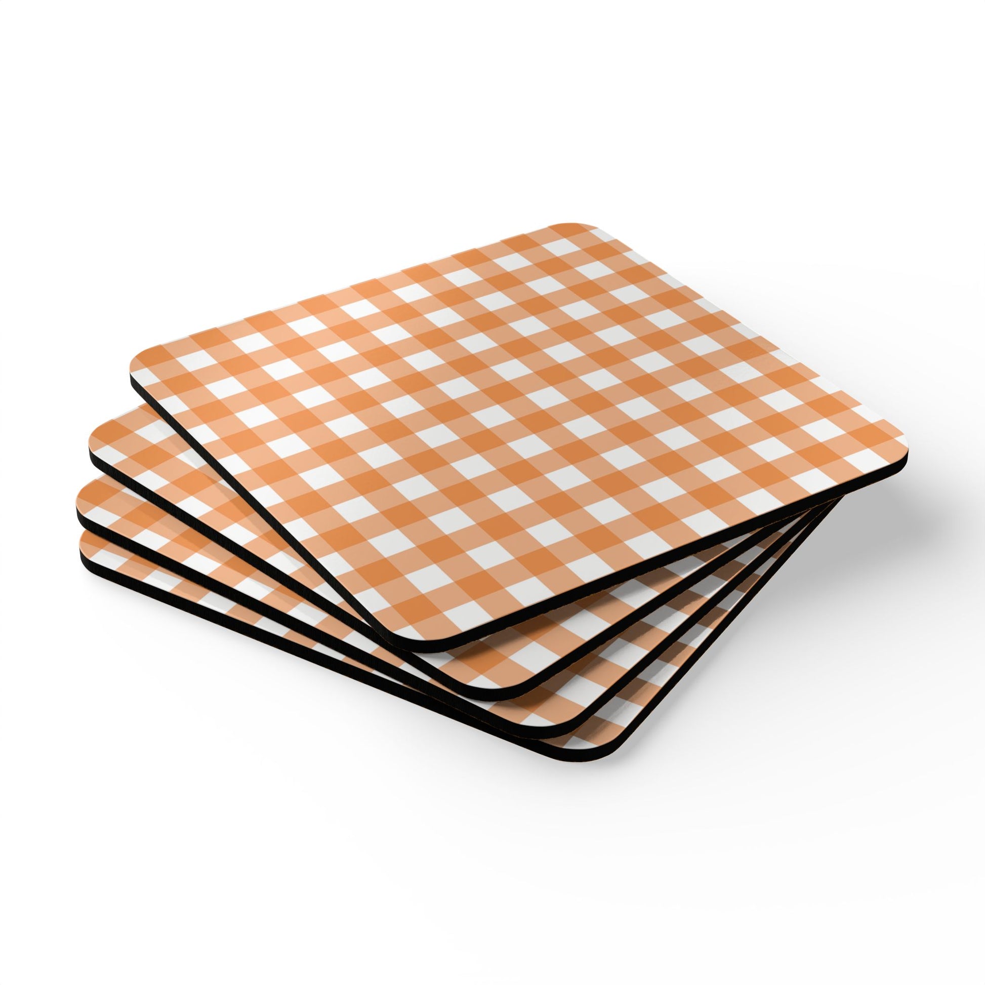 Four orange and white gingham checkered coasters on a white background