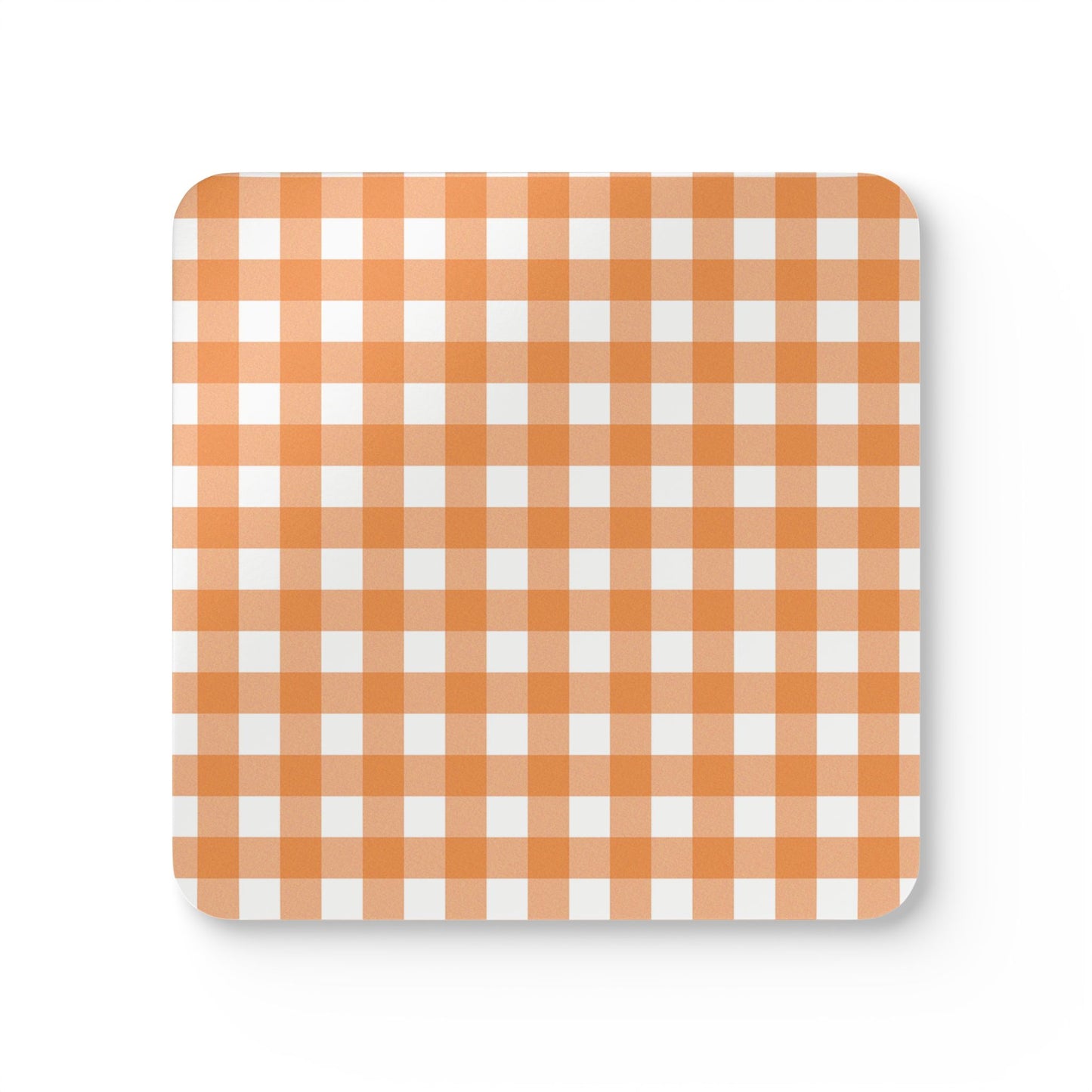 Square coaster with orange and white gingham checkered pattern on a white background