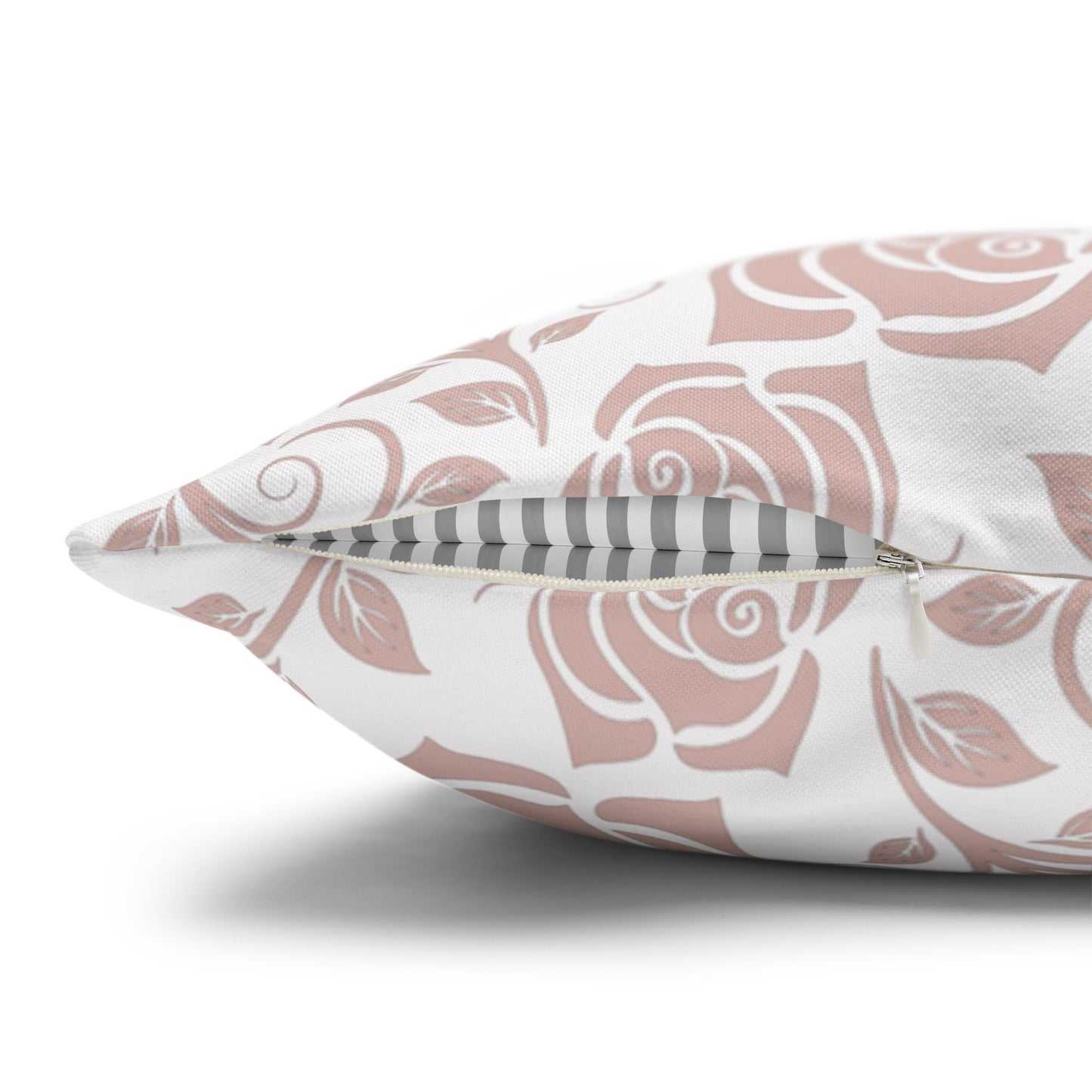 Decorative pillow with pink floral pattern with a zipper closure on a white background
