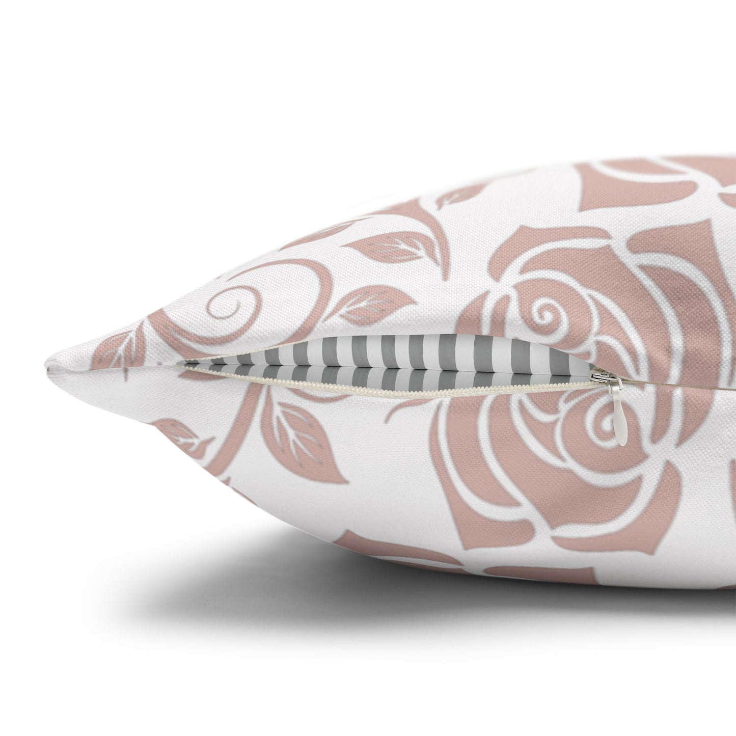 Decorative pillow with pink floral pattern with zipper closure on a white background