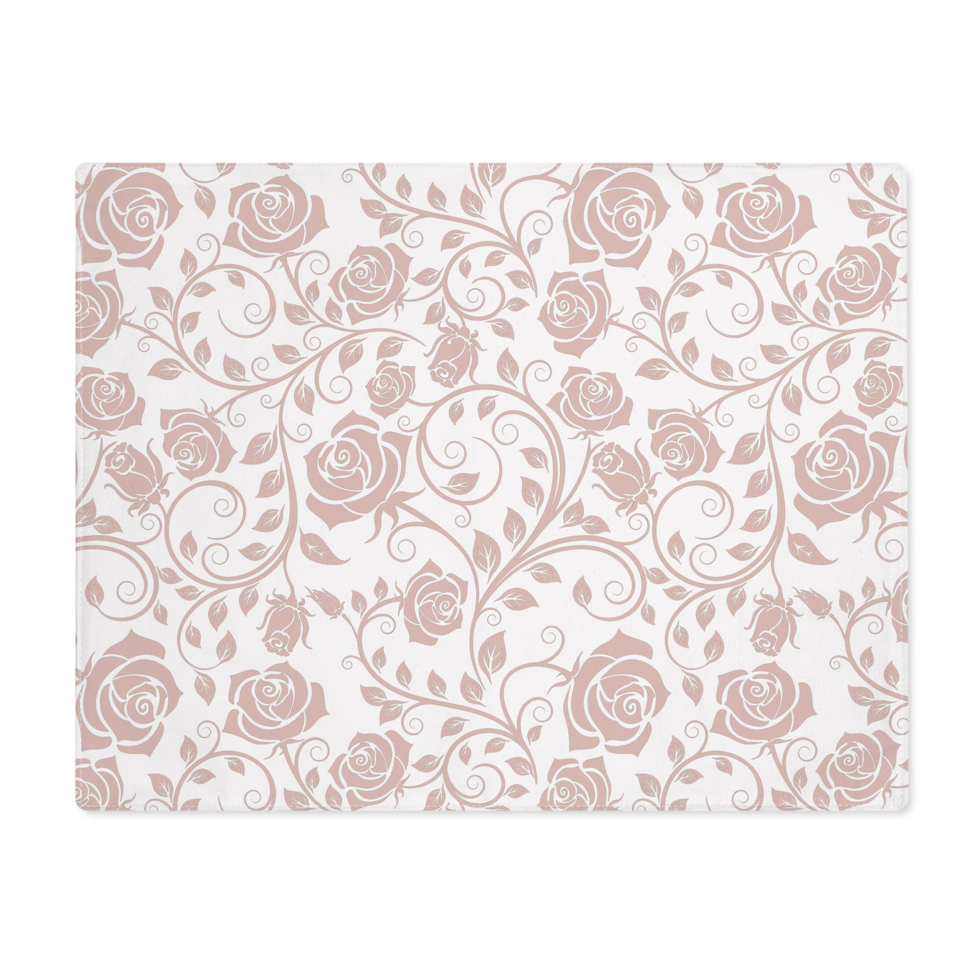 Decorative pink placemat with rose floral pattern on a white background