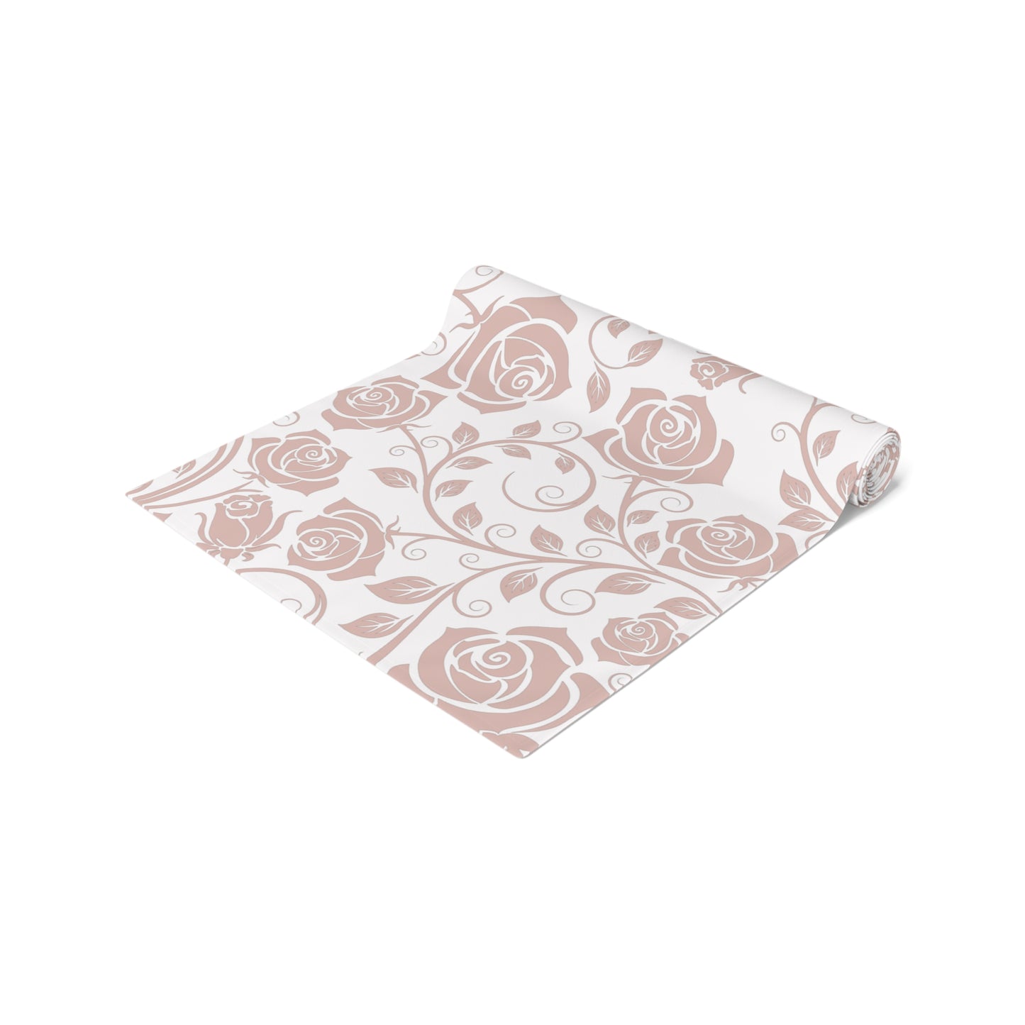 Pink floral patterned table runner rolled up on a white background