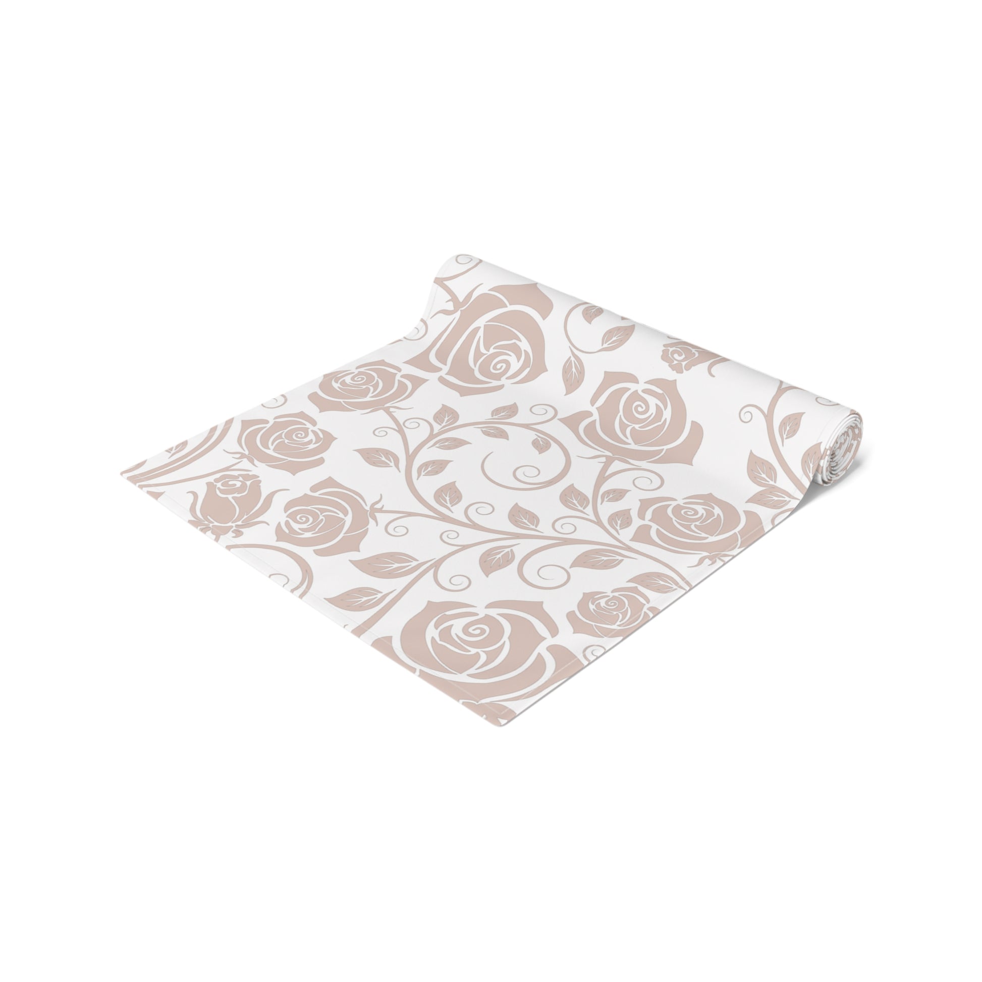 Floral patterned table runner rolled up on a white background