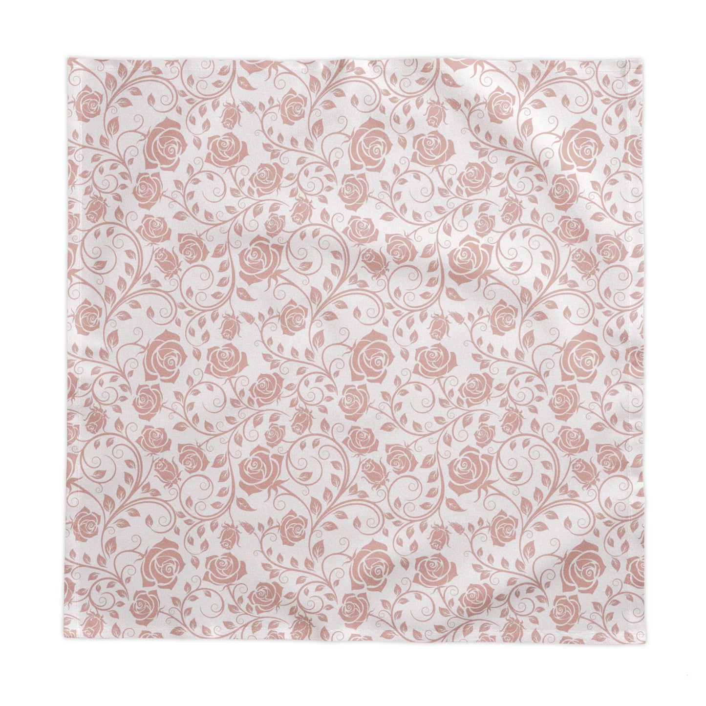 Pink and white square floral patterned tablecloth with pink roses on a white background