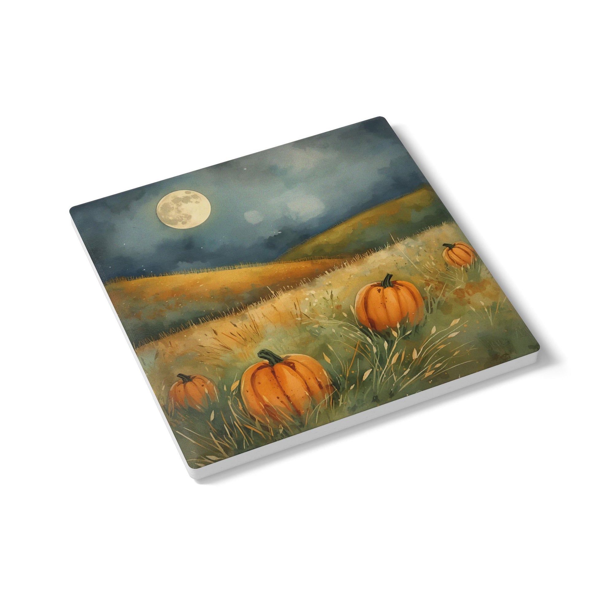 Pumpkin Field square ceramic tile coaster with image of pumpkins in a field under a full moon printed on top of coaster on a white background.