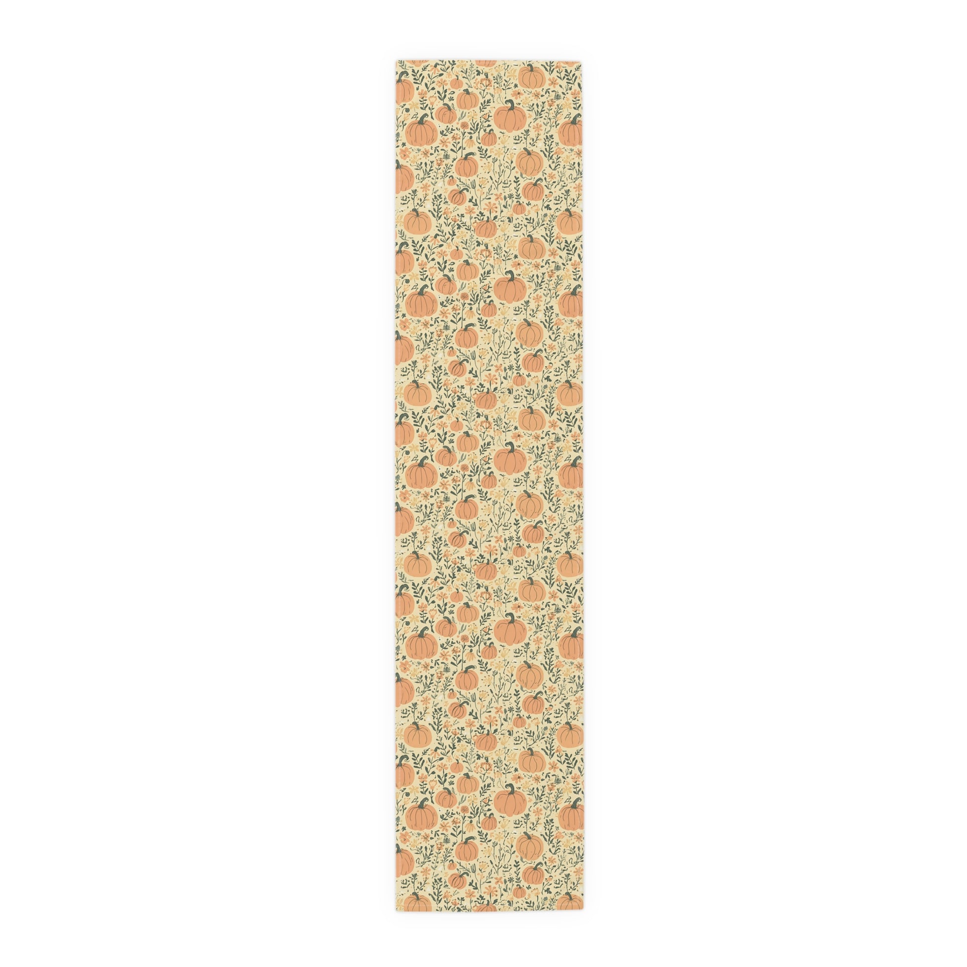 Our polyester 16" x 72" Pumpkin Garden table runner has an orange pumpkin and flowers table runner design on a white background