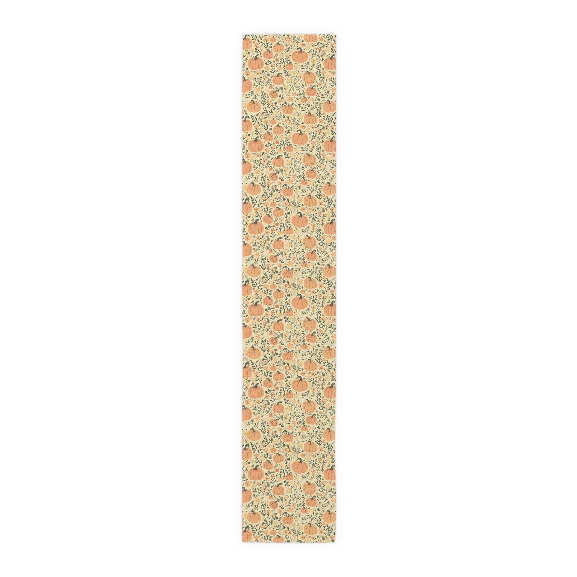 Our 16" x 90" cotton twill Pumpkin Garden table runner has an orange pumpkin and flowers table runner design on a white background