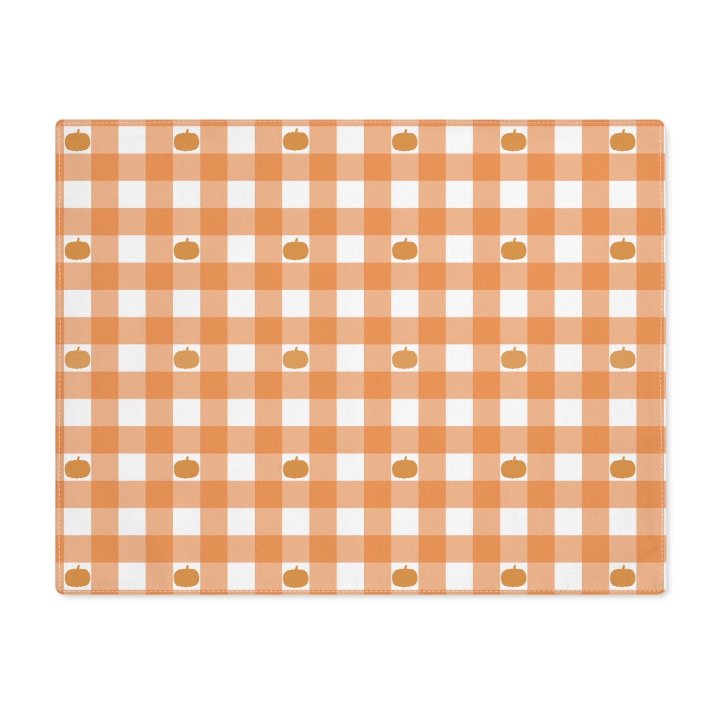 Our Pumpkin Gingham placemat has an orange and white checkered pattern with small pumpkins on the cotton twill placemat fabric  on a white background