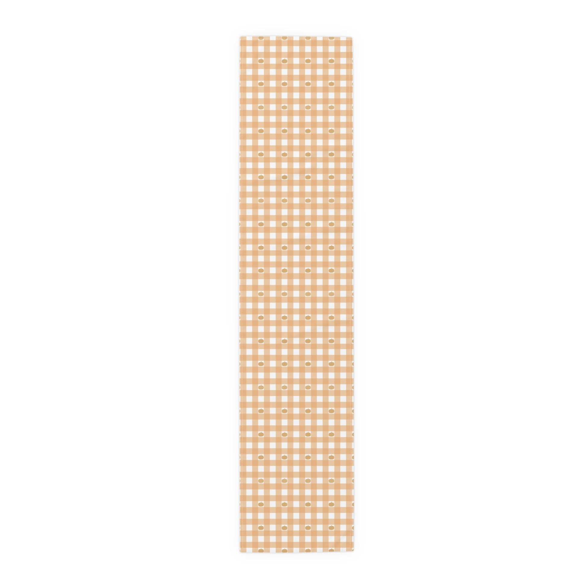 Our 16" x 72" cotton twill Pumpkin Gingham table runner has an orange and white checkered pattern with small pumpkins on the table runner fabric on a white background