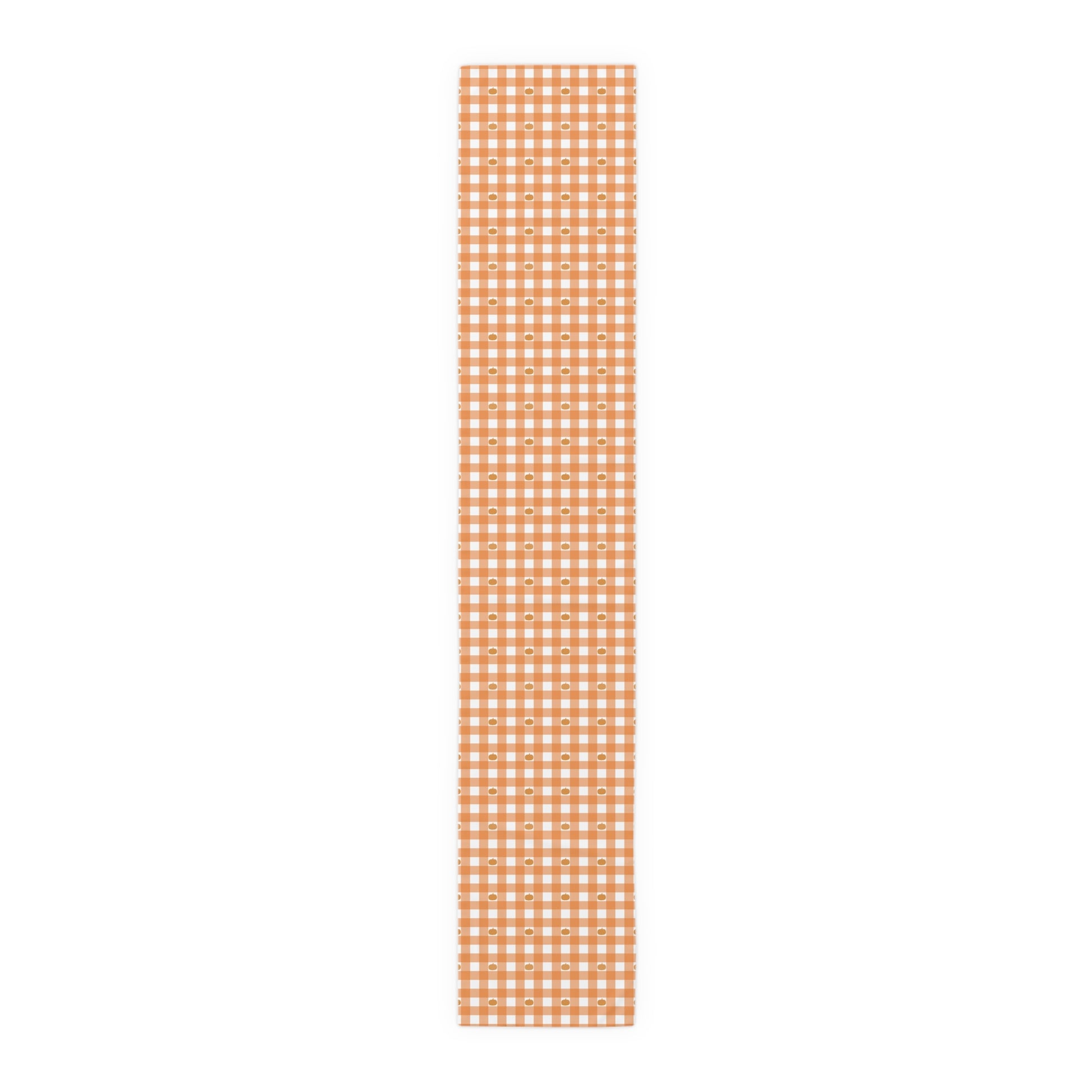 Our 16" x 90" polyester Pumpkin Gingham table runner has an orange and white checkered pattern with small pumpkins on the table runner fabric  on a white background
