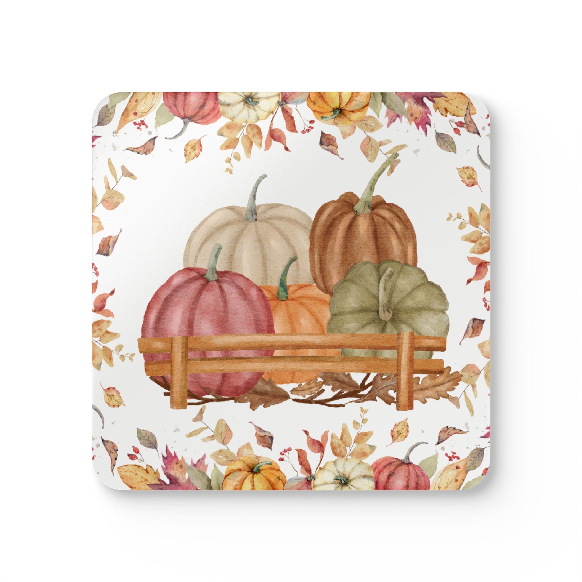 Decorative coaster with pumpkins and autumn leaves on a white background
