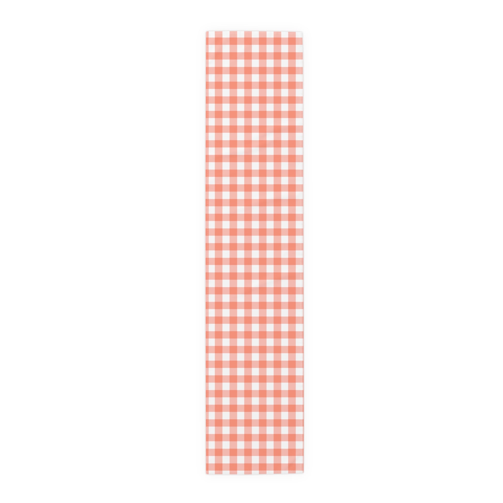 Red and white gingham checkered table runner on a white background