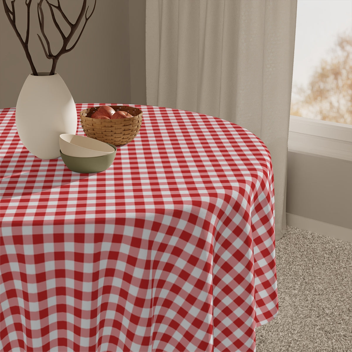 Small wooden table with a square red and white gingham checkered tablecloth on a white background