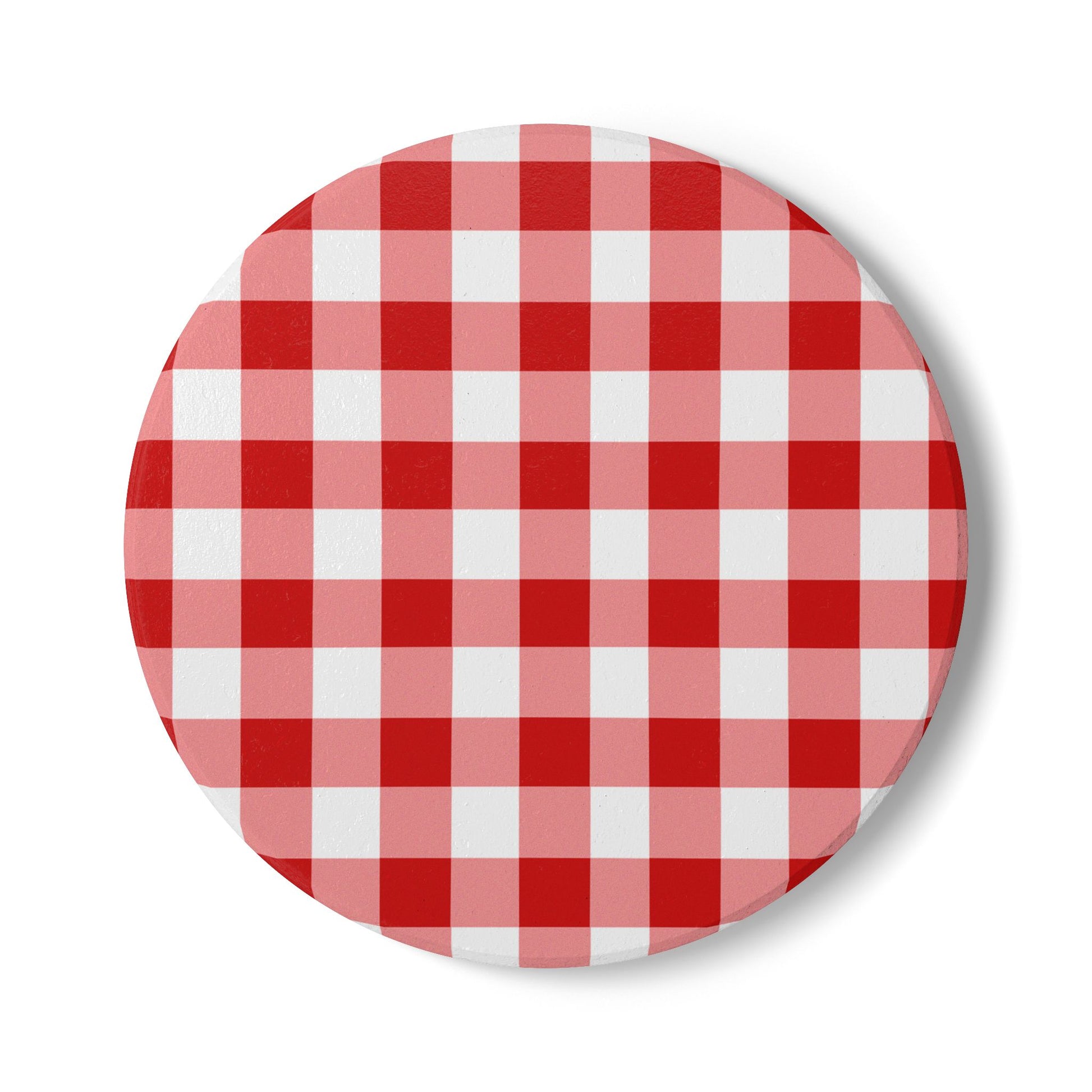Red gingham round ceramic tile coaster with red and white checkered pattern on front of coaster, on a white background.