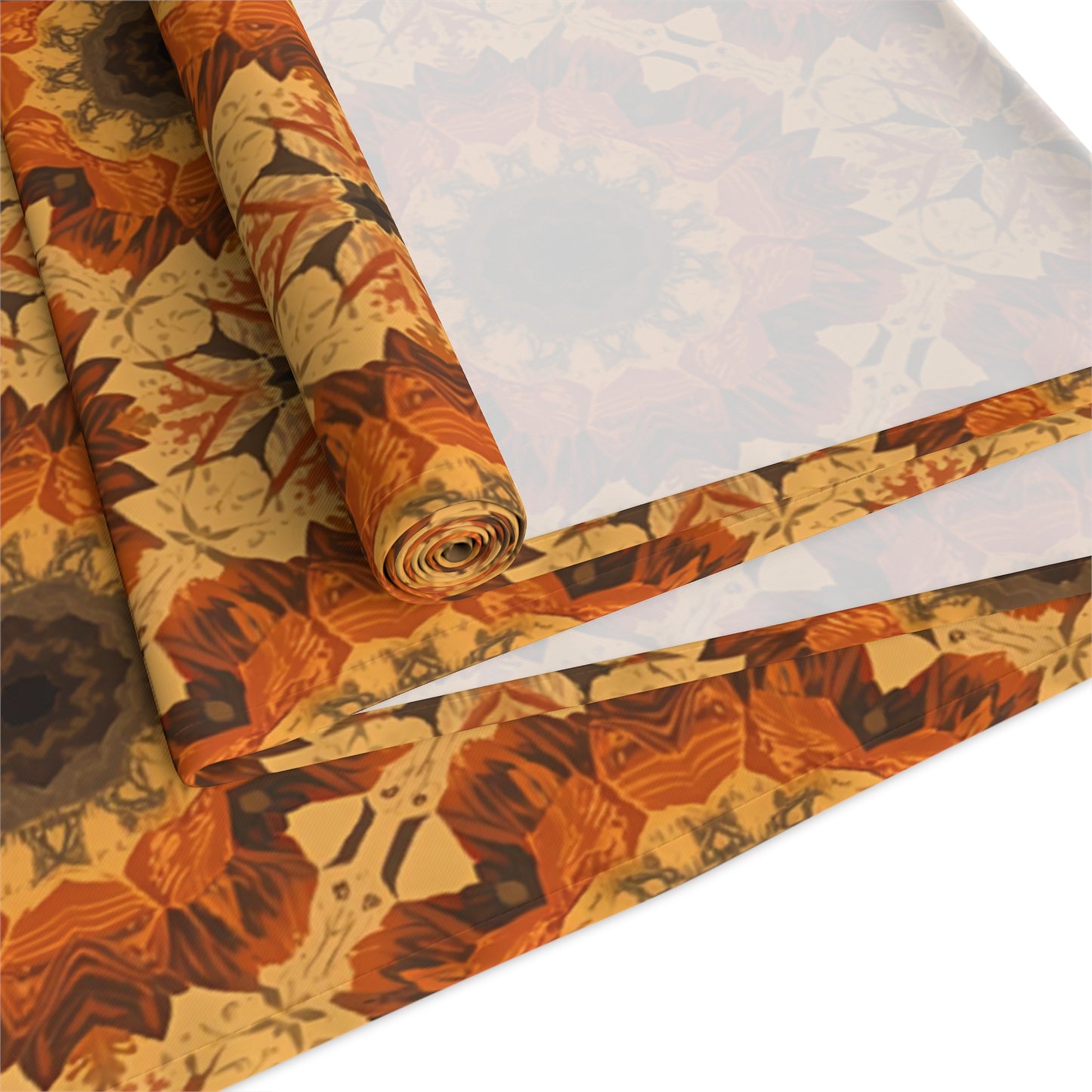 Roll of tye-dye floral-patterned polyester table runner with autumn colors on a white background