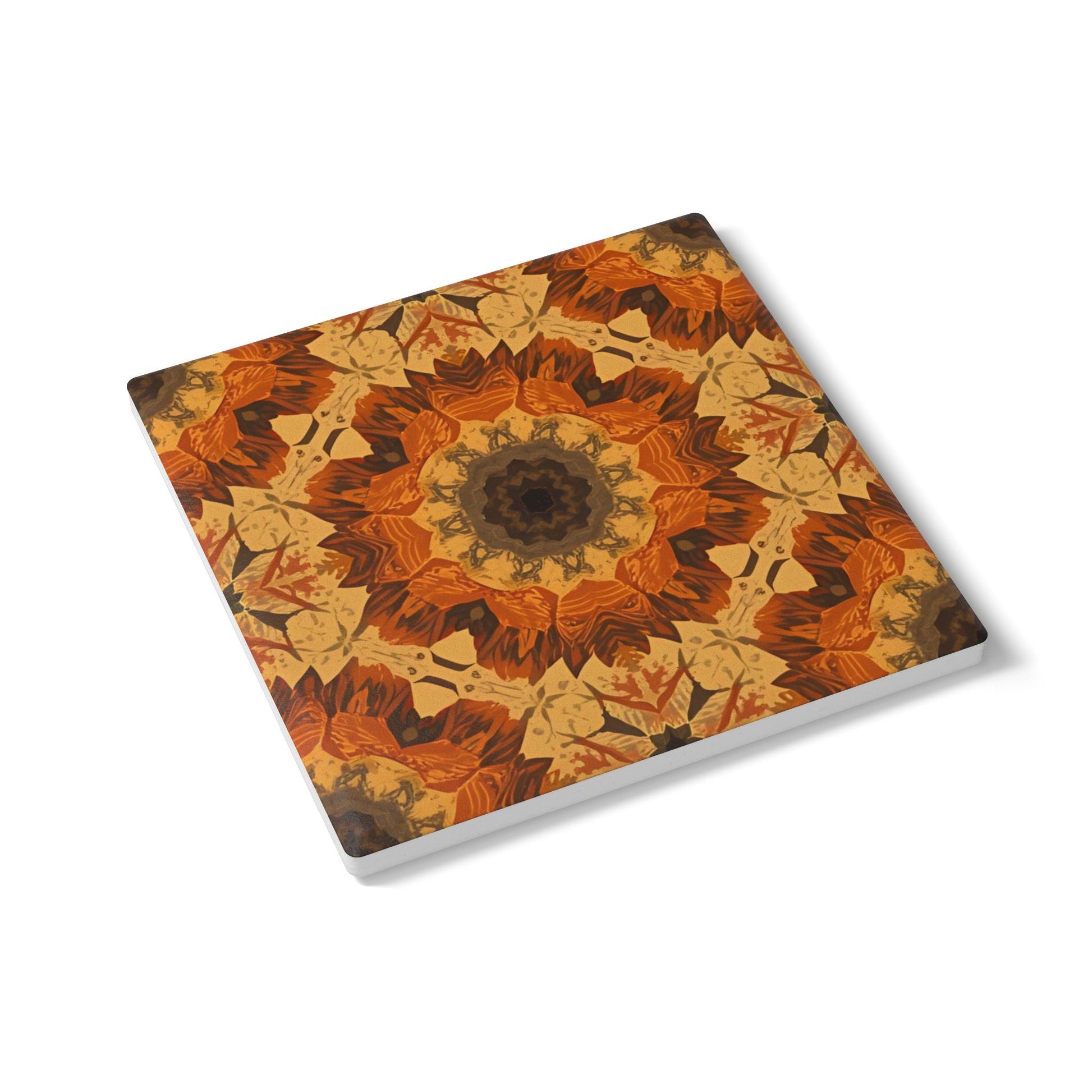 Square tile coaster with an orange, yellow and gray floral pattern on a white background