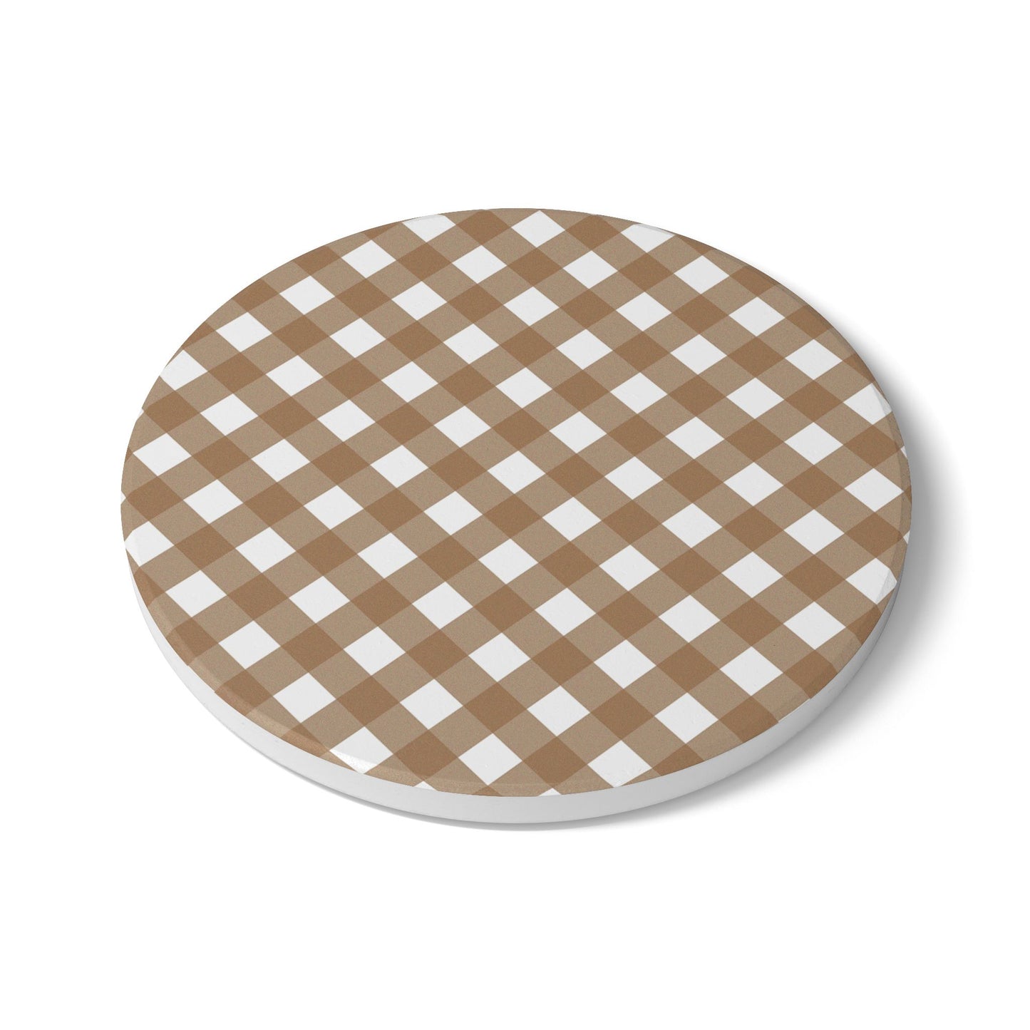 Round ceramic tile coaster with brown and white gingham checkered pattern on a white background