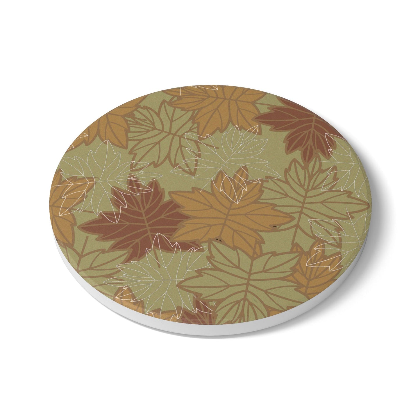 Round ceramic tile coaster with autumn leaf pattern on a white background