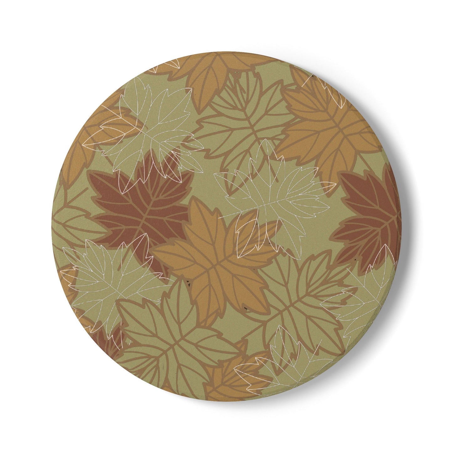Round ceramic tile coaster with autumn leaf pattern on a green background