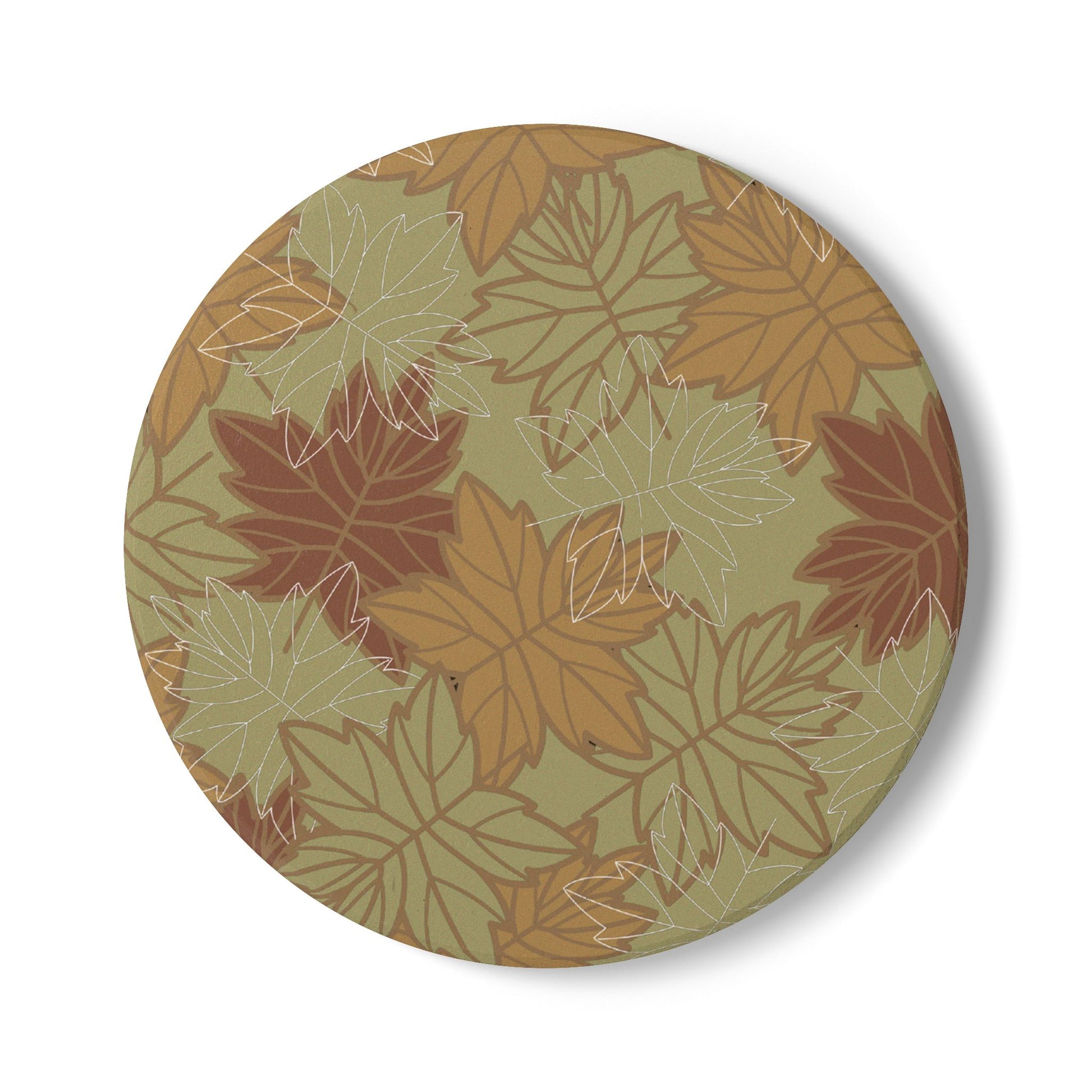 Round ceramic tile coaster with autumn leaf pattern on a green background