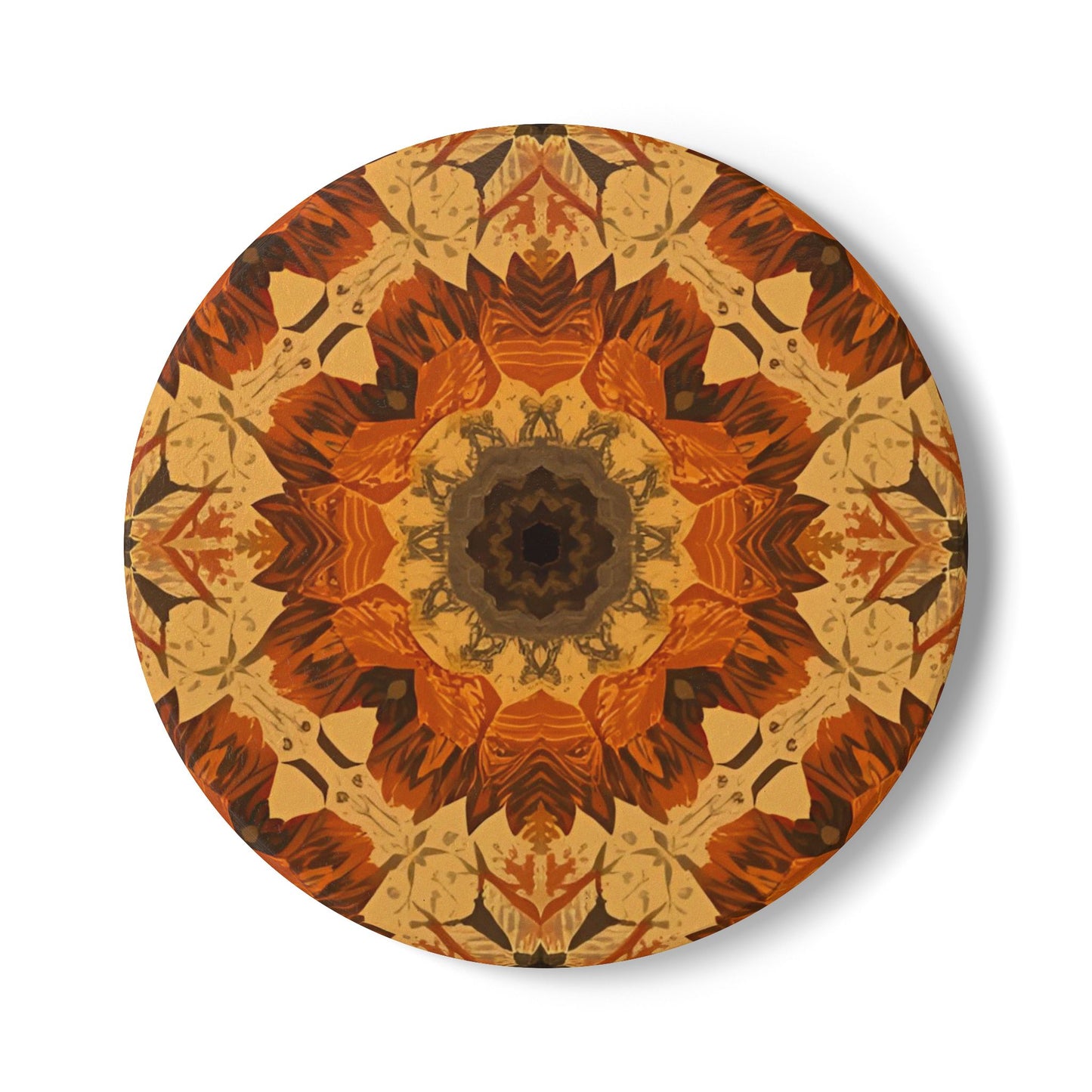 Round ceramic tile coaster with a gray, yellow and orange geometric floral pattern on a white background